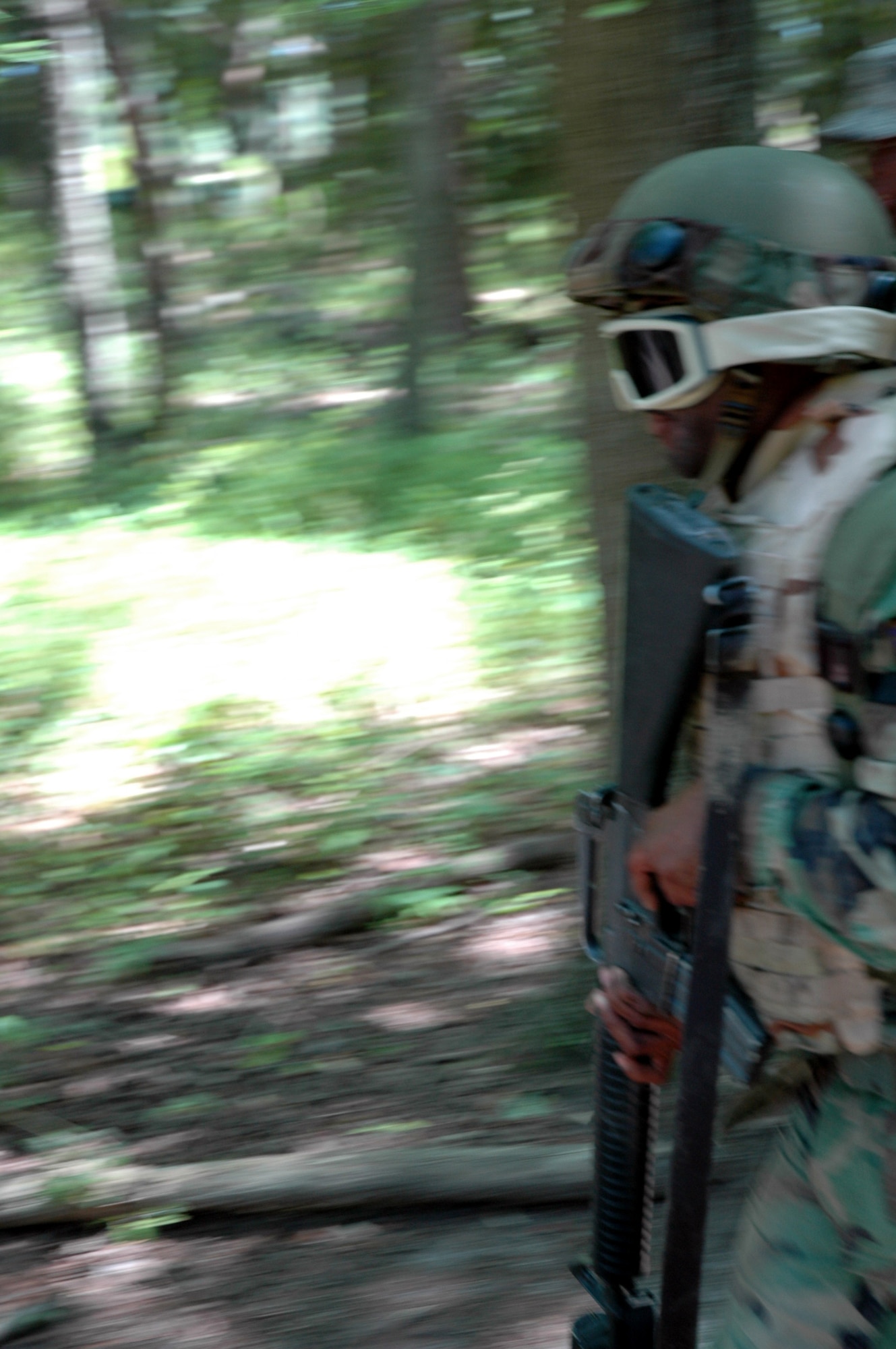 A student in the Advanced Contingency Skills Training Course 08-5 goes through the combat first aid obstacle course during training in the course July 16, 2008, on a Fort Dix, N.J., range.  The course, taught by the U.S. Air Force Expeditionary Center's 421st Combat Training Squadron, prepares Airmen for upcoming deployments.  (U.S. Air Force Photo/Staff Sgt. Paul R. Evans)