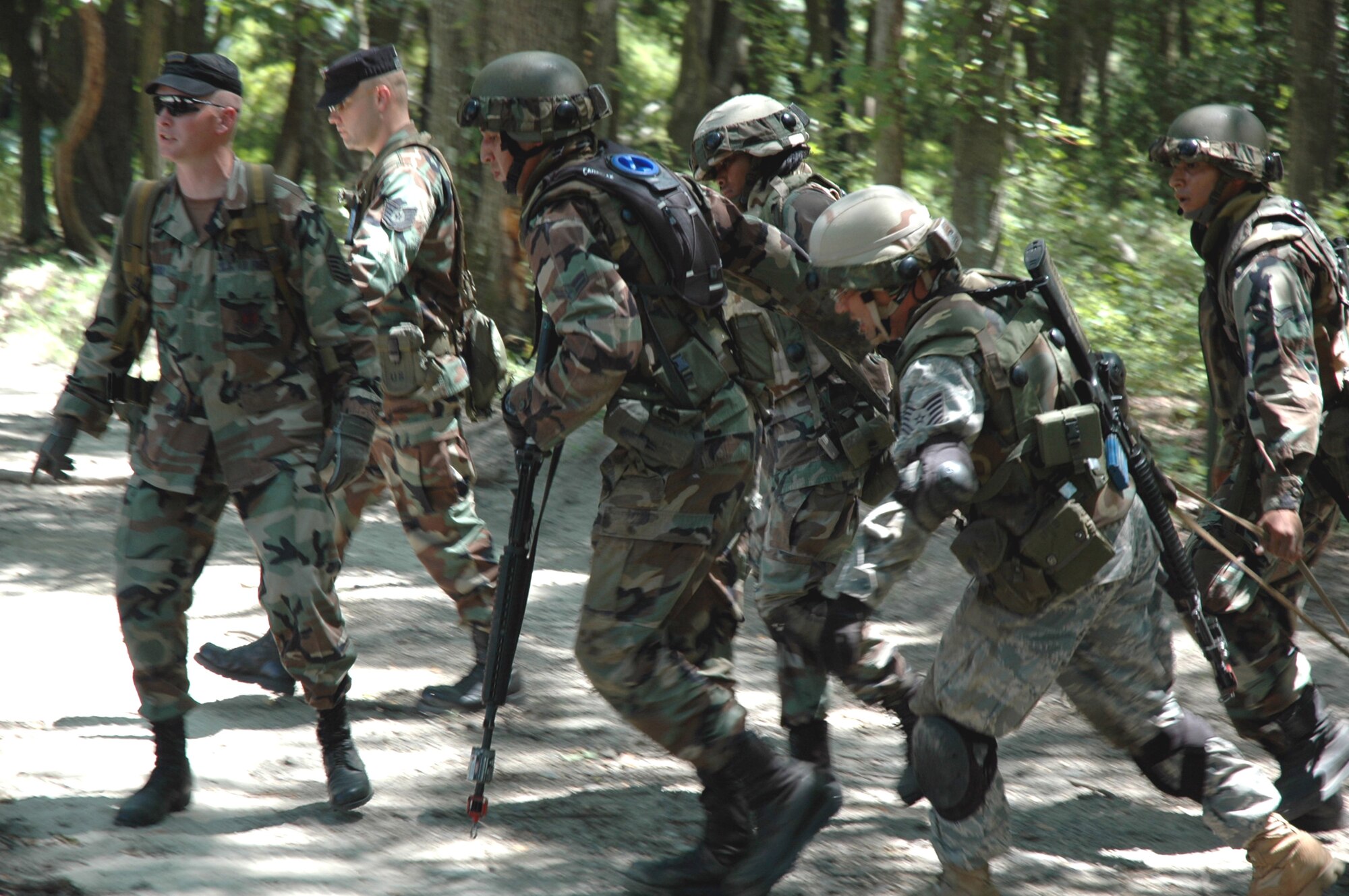 Students in the Advanced Contingency Skills Training Course 08-5 practice combat first aid during training in the course July 16, 2008, on a Fort Dix, N.J., range.  The course, taught by the U.S. Air Force Expeditionary Center's 421st Combat Training Squadron, prepares Airmen for upcoming deployments.  (U.S. Air Force Photo/Staff Sgt. Paul R. Evans)