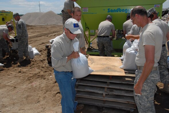 Governor Mitch Daniels assisting Guardsmen in sandbag operations at; Vincennes Indiana Department of Transportation on Tuesday; 10 June 2008. (U.S. Air Force photo by Senior Master Sgt. John S. Chapman)