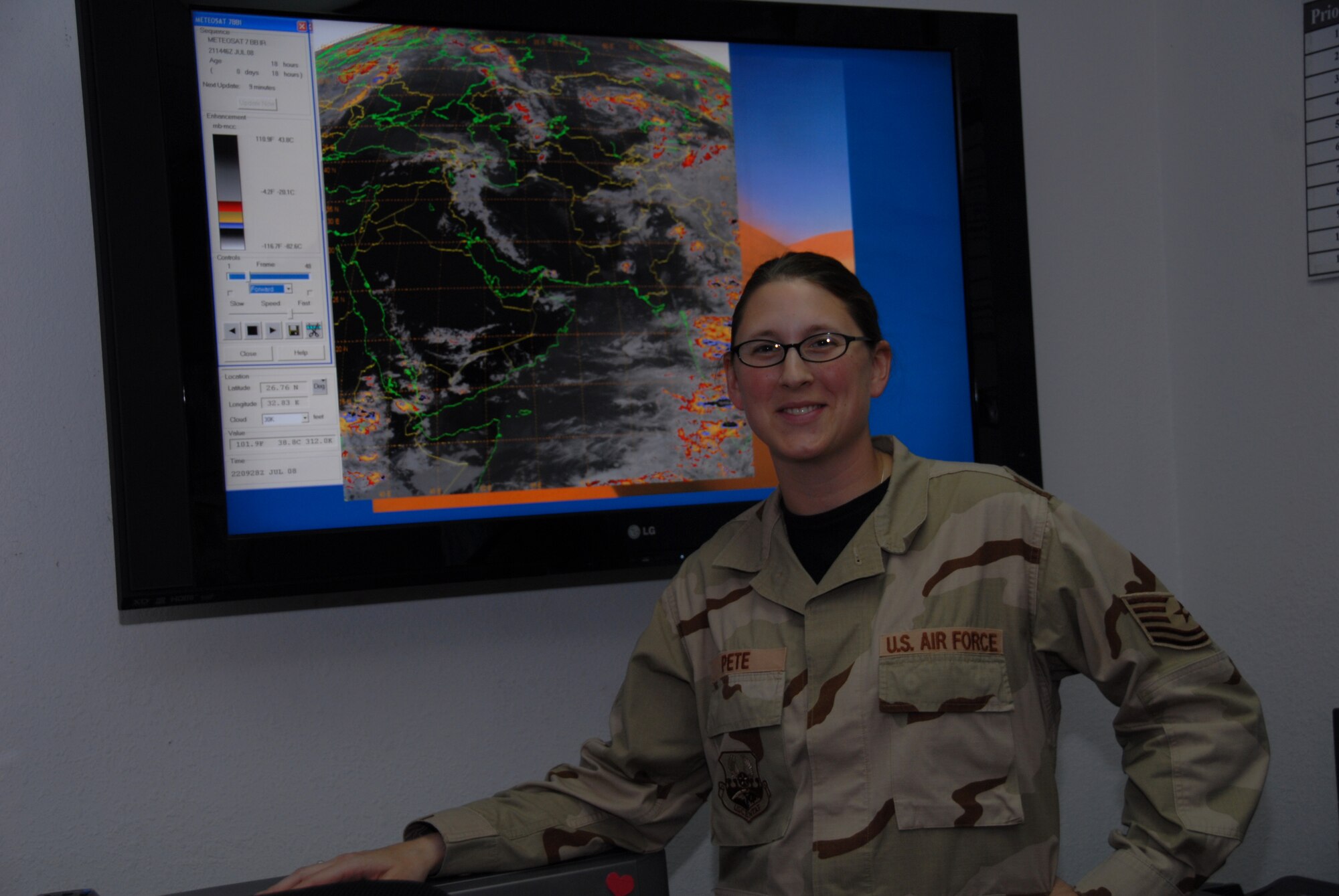 SOUTHWEST ASIA--Tech. Sgt. Tracy Pete a member of the 380th Expeditionary Operations Support Squadron is constantly checking weather conditions here July 22. Her job is vital to the day to day operations in support of Operation Iraqi and Enduring Freedom. Tech. Sgt. Pete is deployed from the 92nd OSS out of Fairchild AFB in Wash., and she is the 380th Air Expeditionary Wing's Warrior of the Week.(U.S. Air Force photo/Tech. Sgt. Christopher A Campbell)