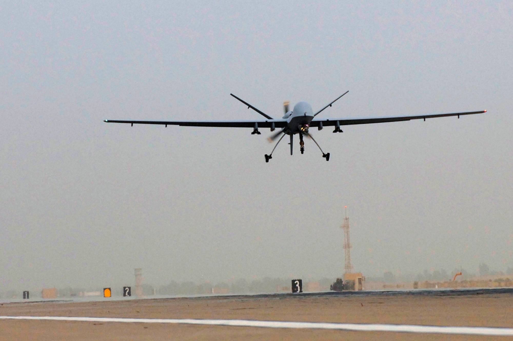 JOINT BASE BALAD, Iraq -- An MQ-9 Reaper remotely piloted aircraft takes off from Joint Base Balad, Iraq, July 17. The Reaper can loiter over battlefields or targets for hours at a time without refueling and carries up to 3,750 pounds of laser-guided munitions, giving ground commanders unprecedented situational awareness and the ability to bring the right amount of force to bear on a target. The Reaper, deployed from Creech Air Force Base, Nev., flew its first combat mission over Iraq July 18. (U.S. Air Force photo/Senior Airman Julianne Showalter)