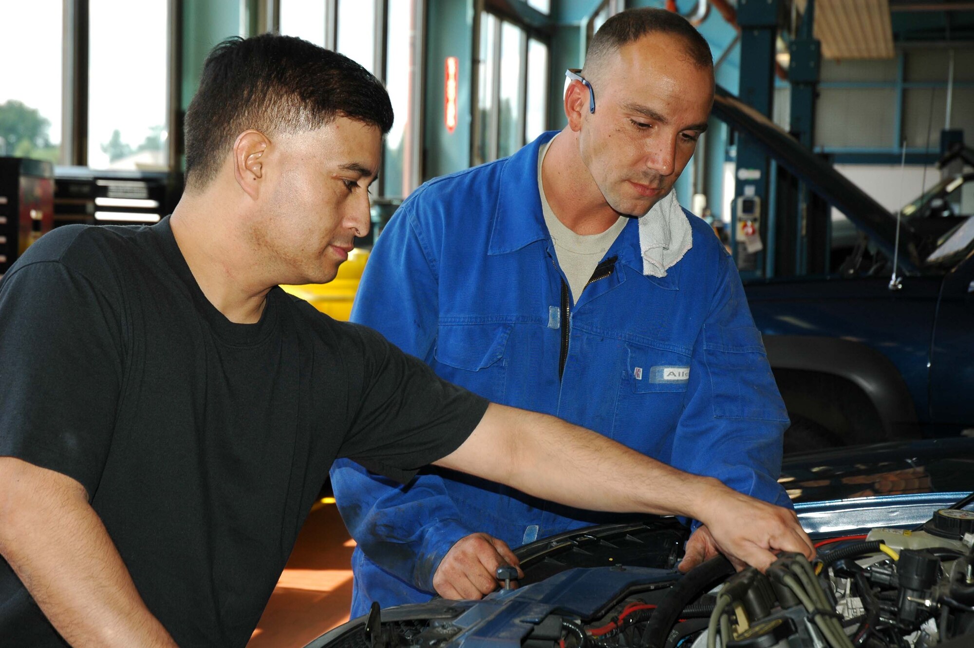 Master Sgt. Israel Martinez (left) and Senior Airman Michael Orso, reservists with the 944th Logistics Readiness Squadron, perform vehicle maintenance at Spangdahlem Air Base, Germany. The 944th LRS is part of a team of 944th Fighter Wing personnel deployed from Luke Air Force Base, Ariz., to Spangdahlem for annual training and to help augment their Regular Air Force counterparts in the 52nd Fighter Wing's units who are short manned due to deployments. (U.S. Air Force photo/Tech. Sgt. Susan Stout)
