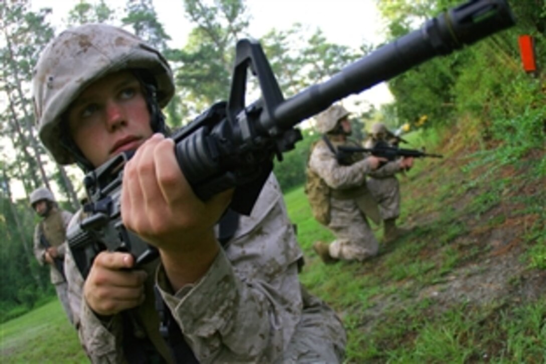 U.S. Navy Seaman Apprentice Dennis Lown provides squad security after finding a simulated explosive device at the Battle Skills Training School on Marine Corps Base Camp Lejeune, N.C., July 22, 2008. Lown is a corpsman assigned to the 2nd Medical Battalion, 2nd Marine Logistics Group. 