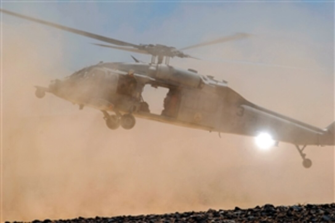 A U.S. Navy MH-60S Seahawk helicopter kicks up dust as sailors assigned to Helicopter Sea Combat Squadron 8 perform terrain flight  training, San Diego, Calif., July 22, 2008. TERF flights are typically flown below 500 feet and are used for the insertion of SEALS or to recover "downed" pilots behind enemy lines. 