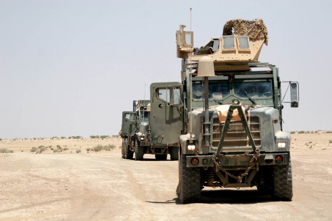 A 7-ton-truck convoys through the Al Jazirah desert July 24 during a convoy while retrograding repair and replenishment point San Francisco. The Marines with Marine Wing Support Squadron 172, 3rd Marine Aircraft Wing spent more than 5 days removing equipment from the replenishment point.  (U.S. Marine Corps photo by Cpl. George J. Papastrat) (Released)