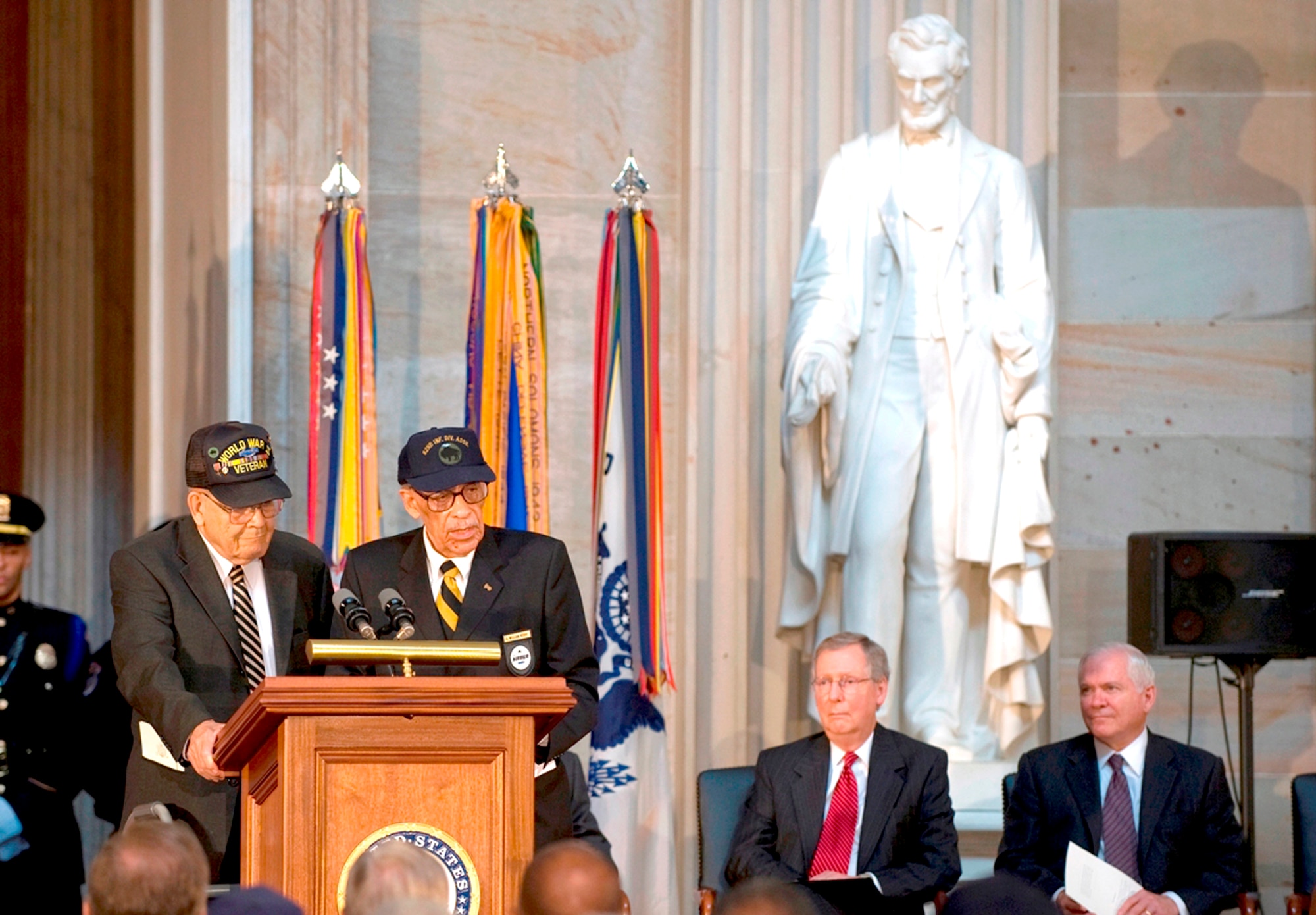World War II veterans Spencer Moore, left, and William Perry address the audience at a ceremony to mark the 60th anniversary of the integration of the armed services in the Capitol Rotunda, Washington, D.C., July 23. (U.S. Army photo/D. Myles Cullen) 