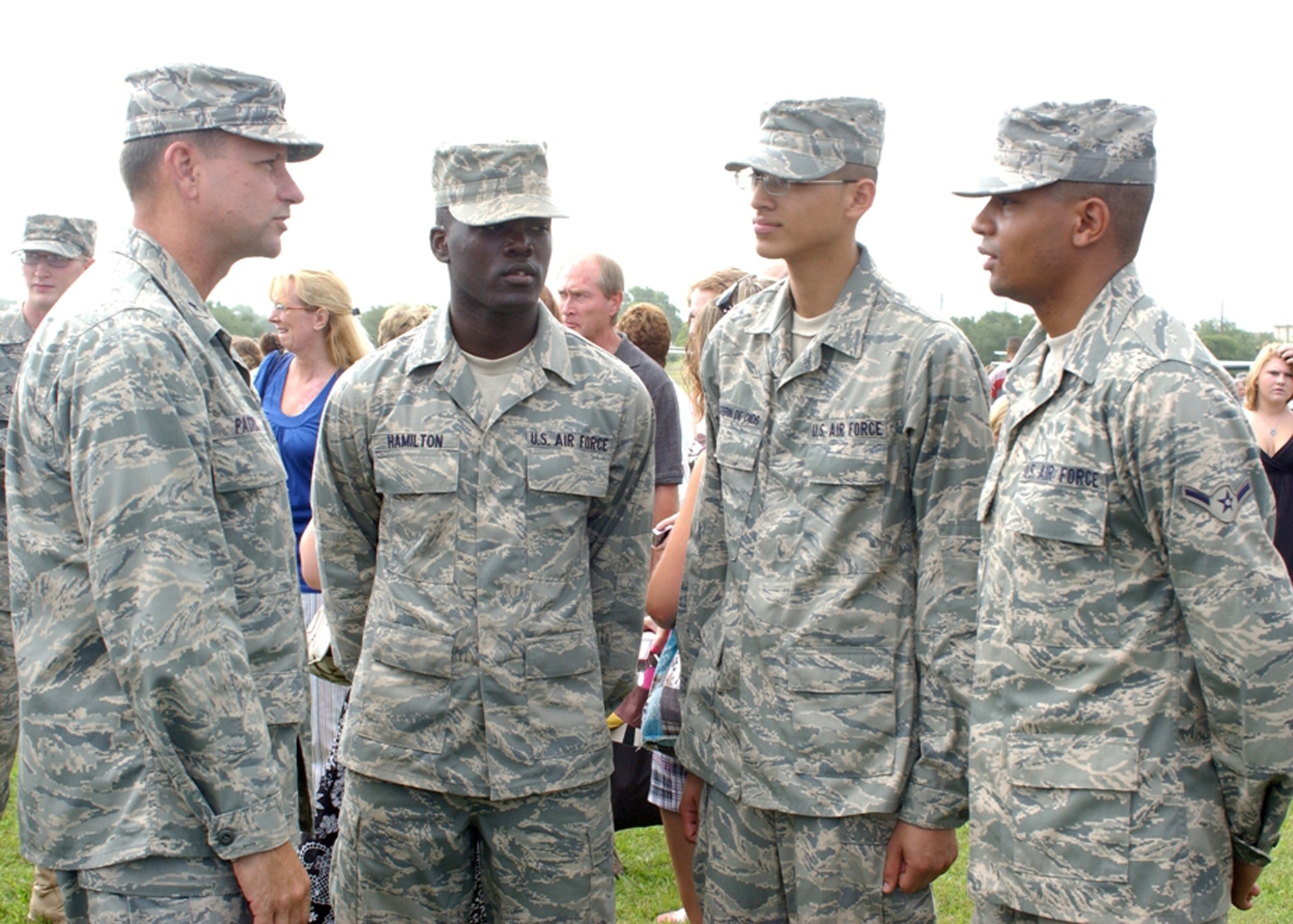 Brig. Gen. Len Patrick, 37th Training Wing commander, speaks with airmen after they graduated during a Basic Military Training graduation ceremony July 25 at Lackland Air Force Base, Texas. (U.S. Air Force photo/Alan Boedeker)

