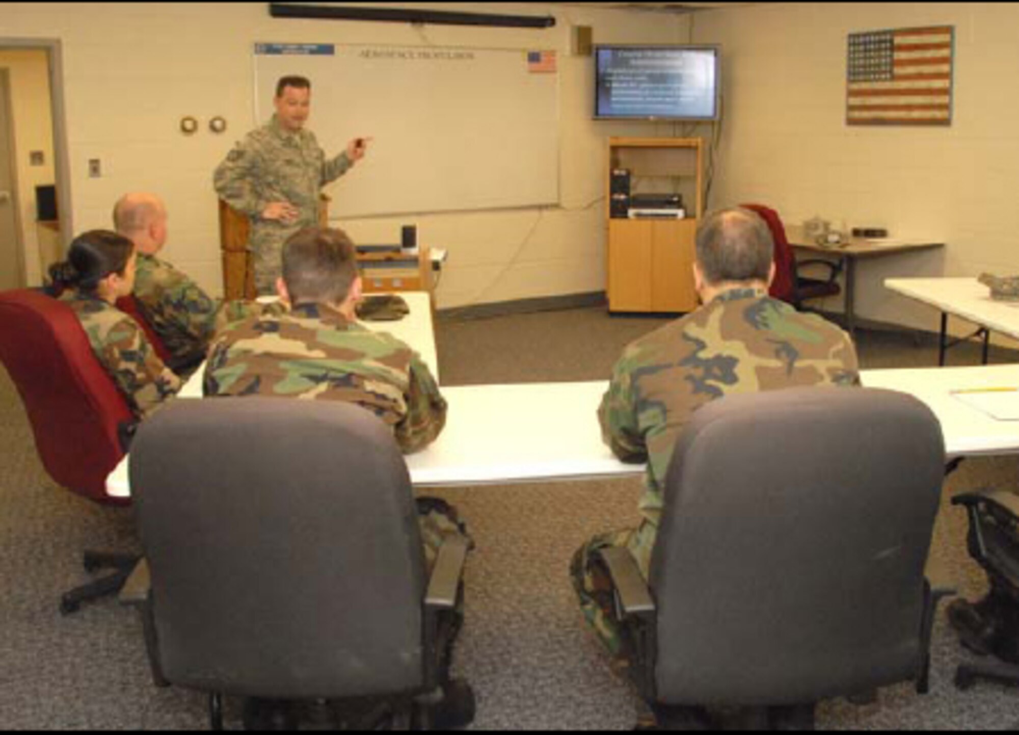 Technical Sgt. Larry T. Beach, instructor, 361st Aerospace Propulsion School, Sheppard Air Force Base, Texas, teaches the first of three 10-week jet engine mechanic training classes in a temporary schoolhouse at Bradley Air National Guard Base May 5, 2008. (U.S. Air Force Photo by Staff Sgt Nicholas A. McCorkle)