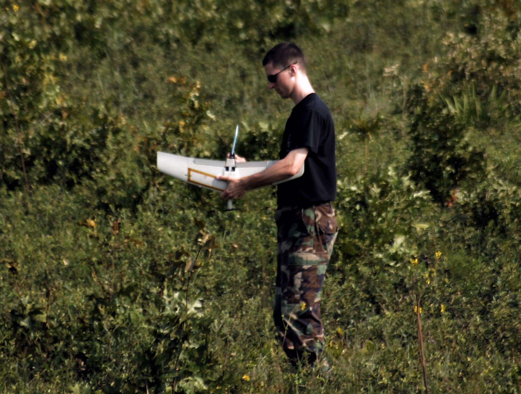 A Battlefield Airman Targeting Micro Air Vehicle is recovered July 25 after it successfully lands during Exercise Bold Quest Plus at Eglin Air Force Base, Fla. (U.S. Air Force photo/Casey Bain)