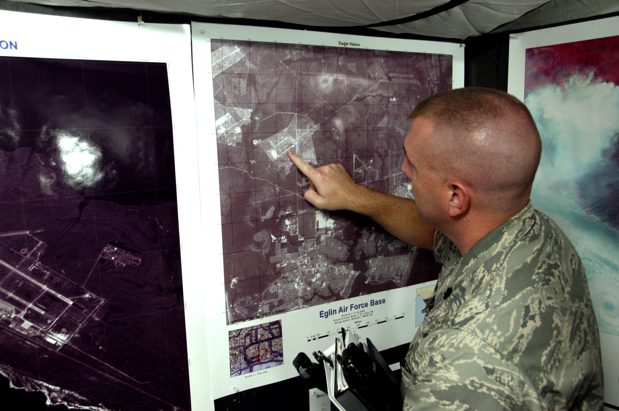 Lt Col David Wiley, 1st AF executive officer, examine images generate through the EAGLE VISION system at Tyndall AFB, Fla.                                