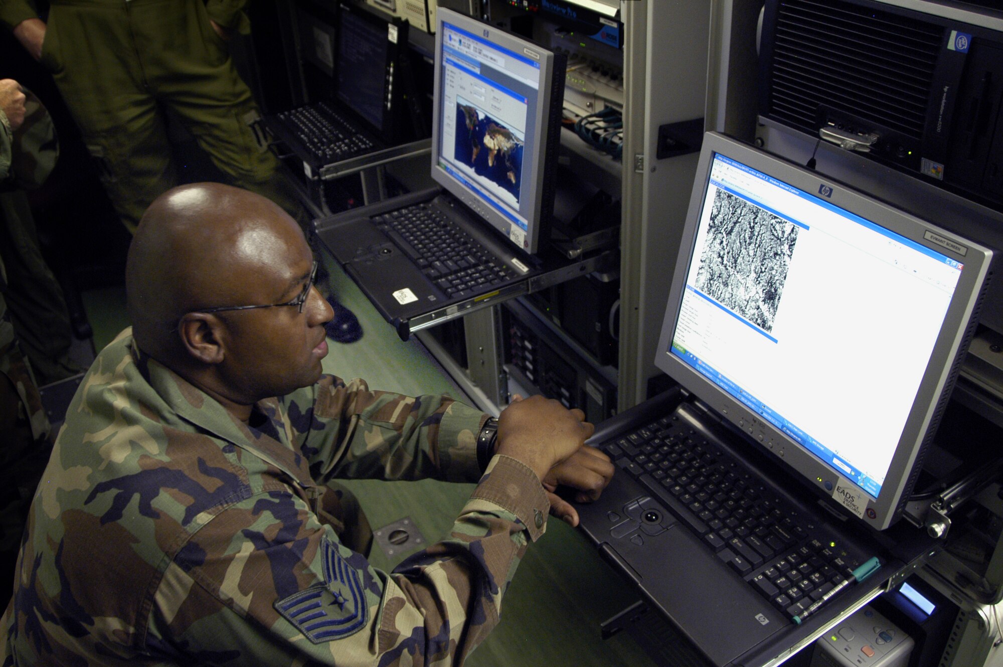 Technical Sgt. Simon Burgess, EAGLE VISION technician, operates the collection systems used to provide large-scale, high-resolution, satellite images in a demonstartion at 1st Air Force.                                