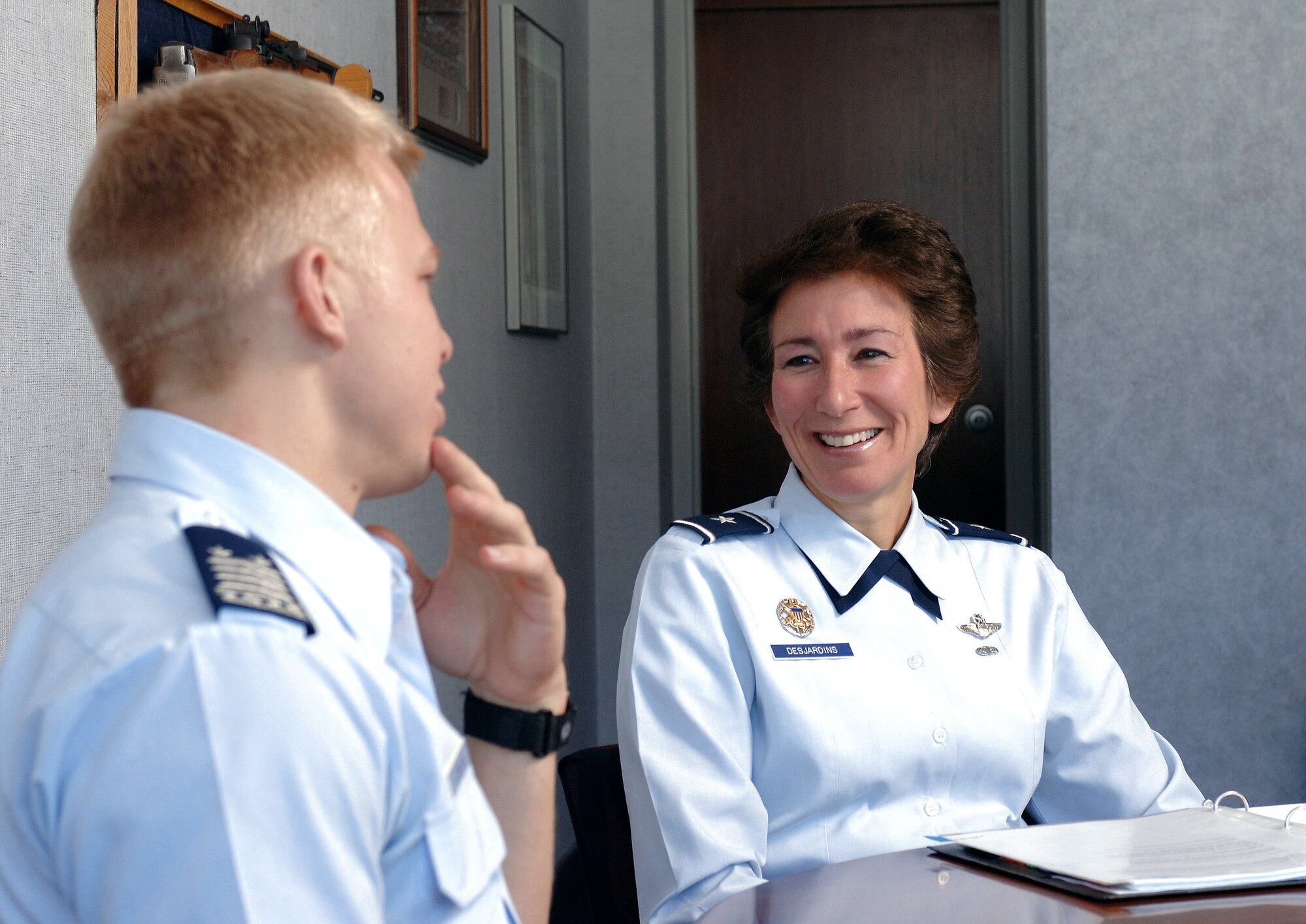 Brig. Gen. Susan Y. Desjardins mentors a cadet July 25 at the Air Force Academy in Colo. General Desjardins has been serving as the commandant of cadets, but will depart the Academy in October to become the Headquarters Air Mobility Command Strategic Plans, Requirements and Programs deputy director at Scott Air Force Base, Ill. (U.S. Air Force photo/Dennis Rogers)