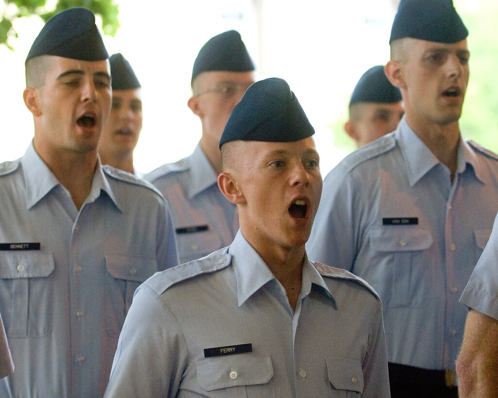 Basic training graduates recite the Airman's Creed during a coin ceremony at Lackland Air Force Base, Texas, July 24.  (Department of Defense photo/Cherie Cullen) 