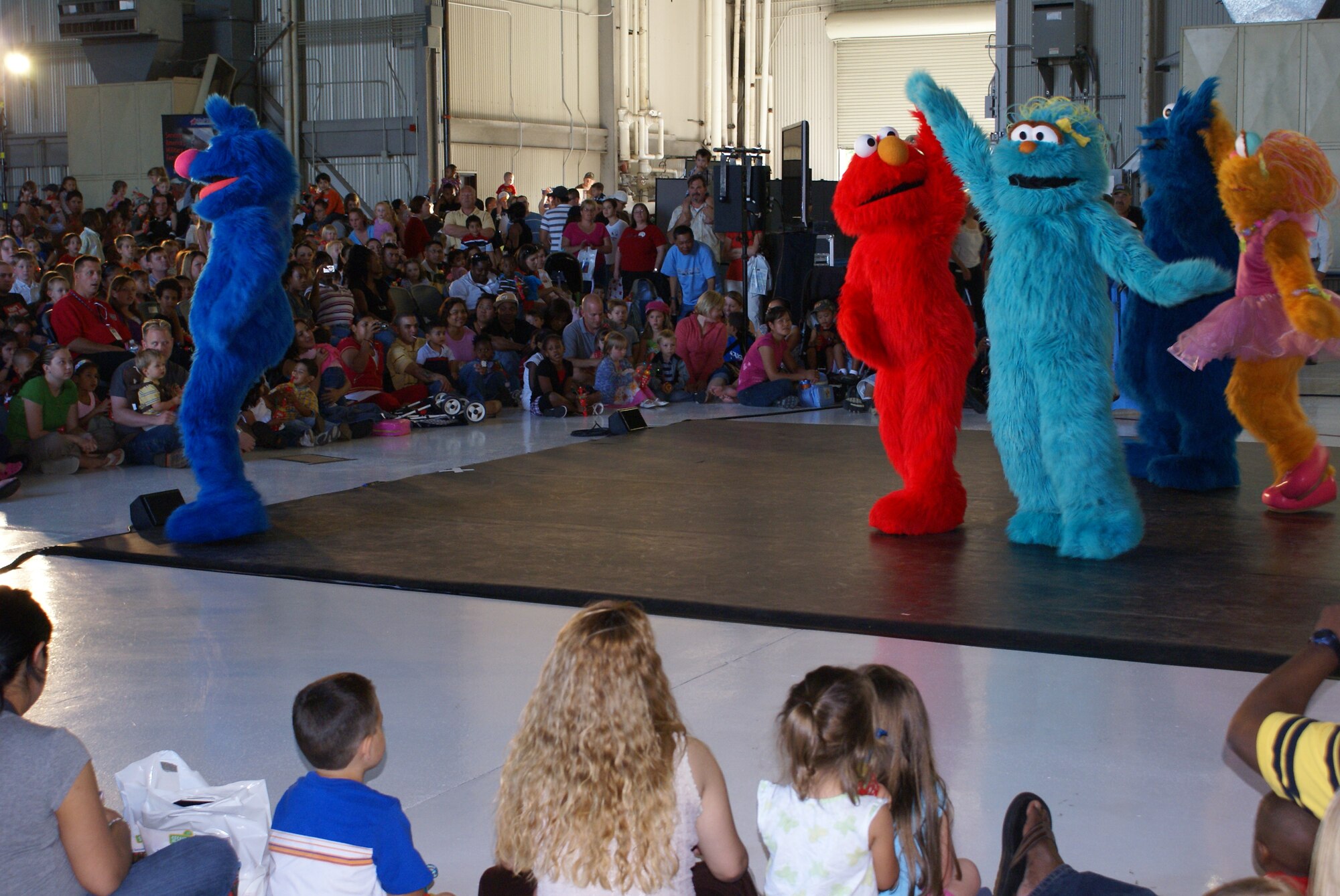 More than 1700 children and their families enjoyed the first Sesame Street Experience performance here July 24 in Hanger 9. A second performance was held here July 25. (U.S. Air Force photo/Staff Sgt. Eric Burks)