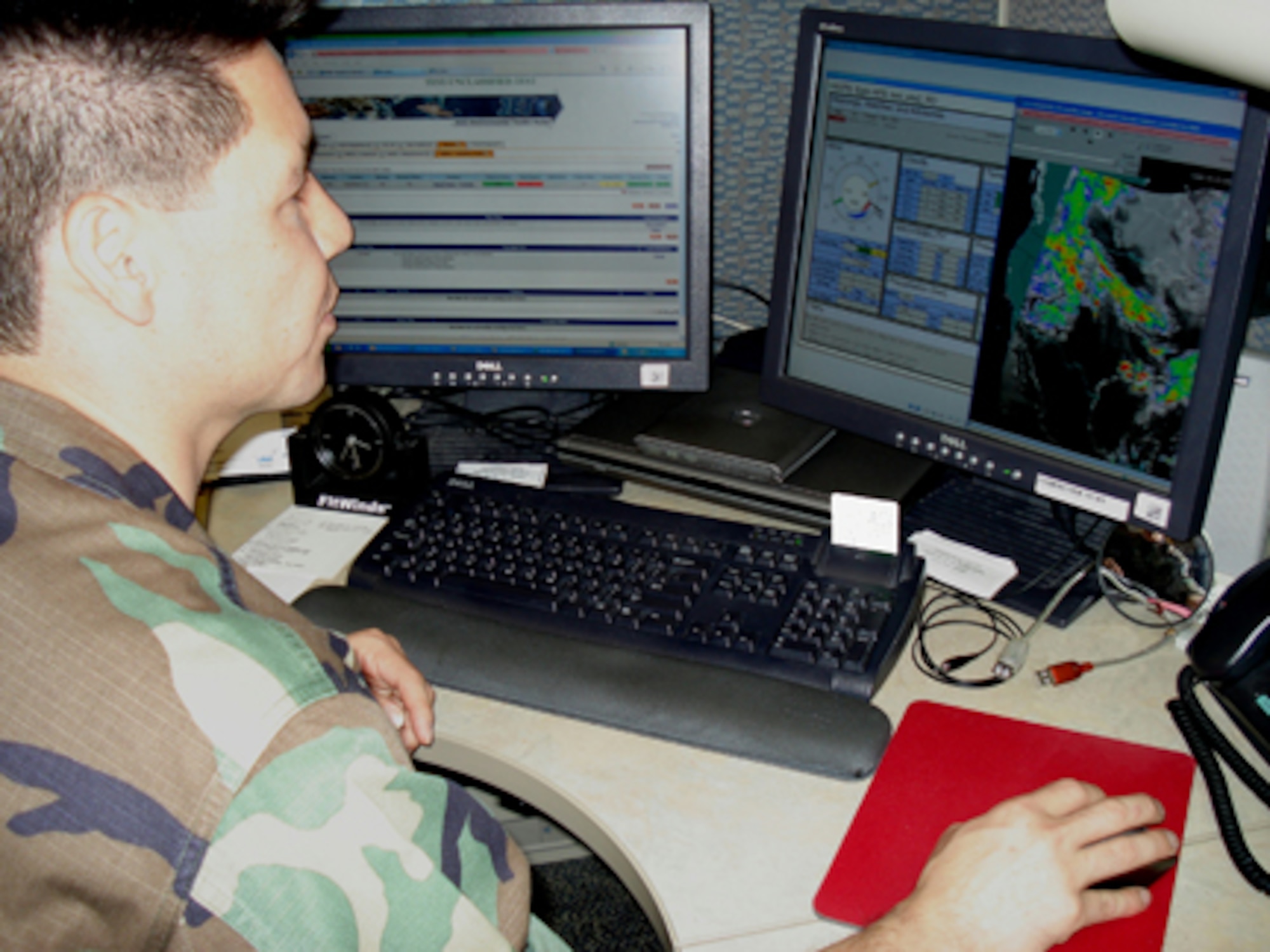HANSCOM AFB - Reserve Capt. Dan Zehner uses the Joint Environmental Toolkit Increment 2 to  view an enhanced satellite image  and an airfield sensor display to monitor weather conditions. JET provides the user with a single, fully integrated system of weather analyses, forecasting, and dissemination capabilities to replace a number of currently separate and disparate systems.  (Courtesy photo)