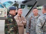 Lt. Co.l Mark Bennett (center), deployed from the 559th Flying Training Squadron here, talks with Lt. Gen. Gary North (right), 9th Air Force and U.S. Air Force's Central Command commander, and an Iraqi officer during a routine visit to Kirkuk Air Base, Iraq. Colonel Bennett relinquished command of his deployed command, the 52nd Expeditionary Flying Training Squadron July 24. (Courtesy photo)