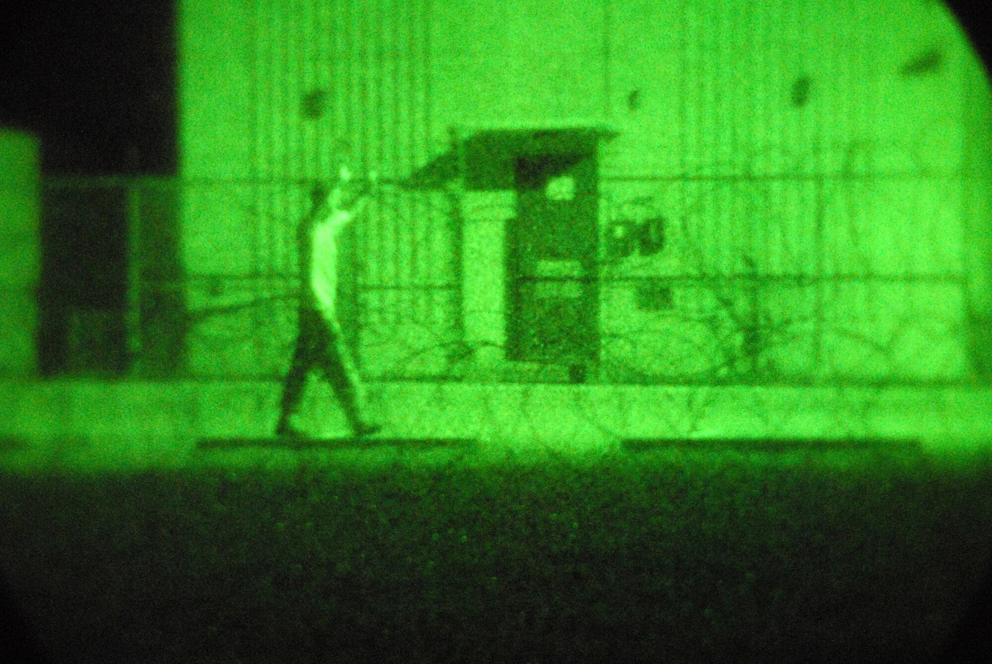 8th Security Forces Squadron members direct a suspicious individual away from the air traffic control tower during a peninsula wide operational readiness exercise July 22 at Kunsan Air Base, South Korea. The PENORE evaluates base personnel's readiness and the ability for them to conduct their wartime missions. (U.S. Air Force photo/Staff Sgt. Jason T. Colbert) 