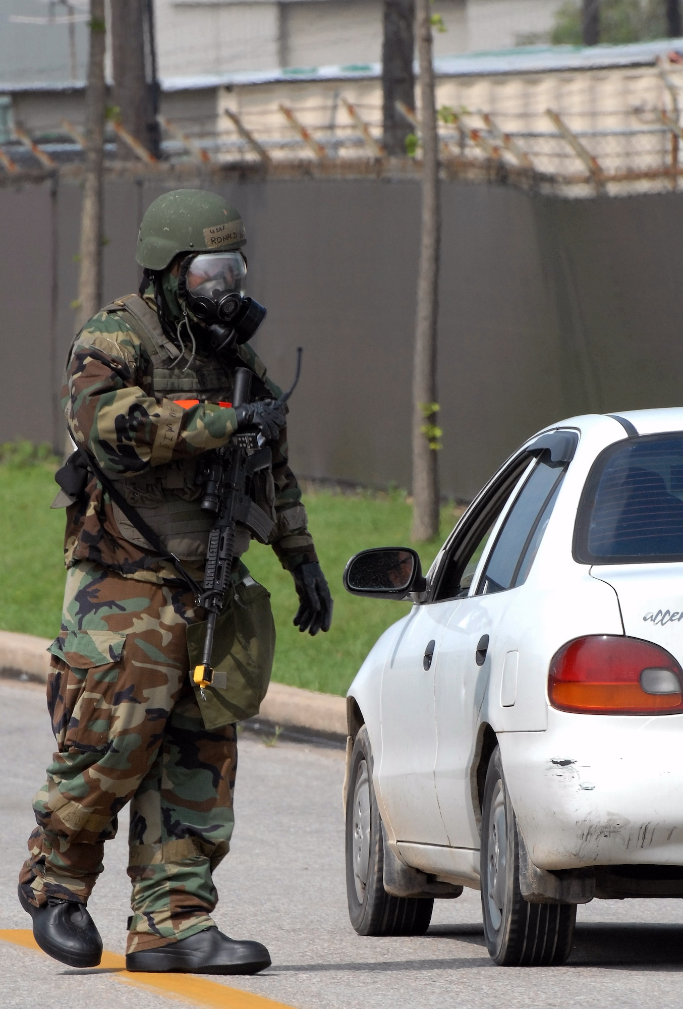 Staff Sgt. Ronald Hale stands guard at an intersection during a bomb threat July 22 at Kunsan Air Base, South Korea. The bomb threat is a part of the peninsula wide operational readiness exercise being conducted to evaluate the wing member's readiness and ability to perform their wartime mission. Sergeant Hale is with the 8th Security Forces Squadron. (U.S. Air Force photo/Tech. Sgt. Quinton T. Burris) 