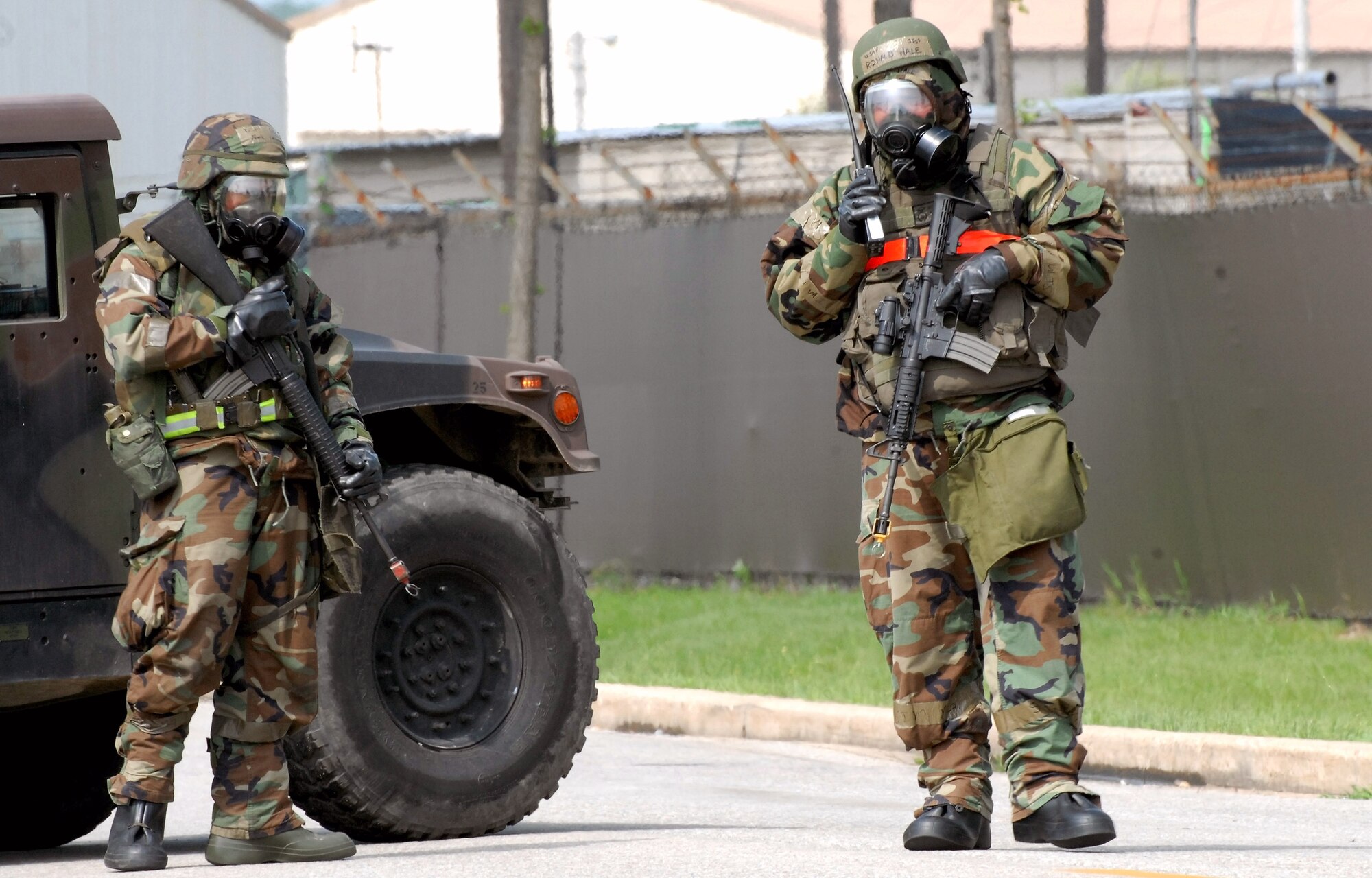 Members of the 8th Security Forces Squadron stand guard at an intersection during a bomb threat July 22 at Kunsan Air Base, South Korea. The bomb threat is a part of the peninsula wide operational readiness exercise being conducted to evaluate the wing member's readiness and ability to perform their wartime mission. (U.S. Air Force photo/Tech. Sgt. Quinton T. Burris) 