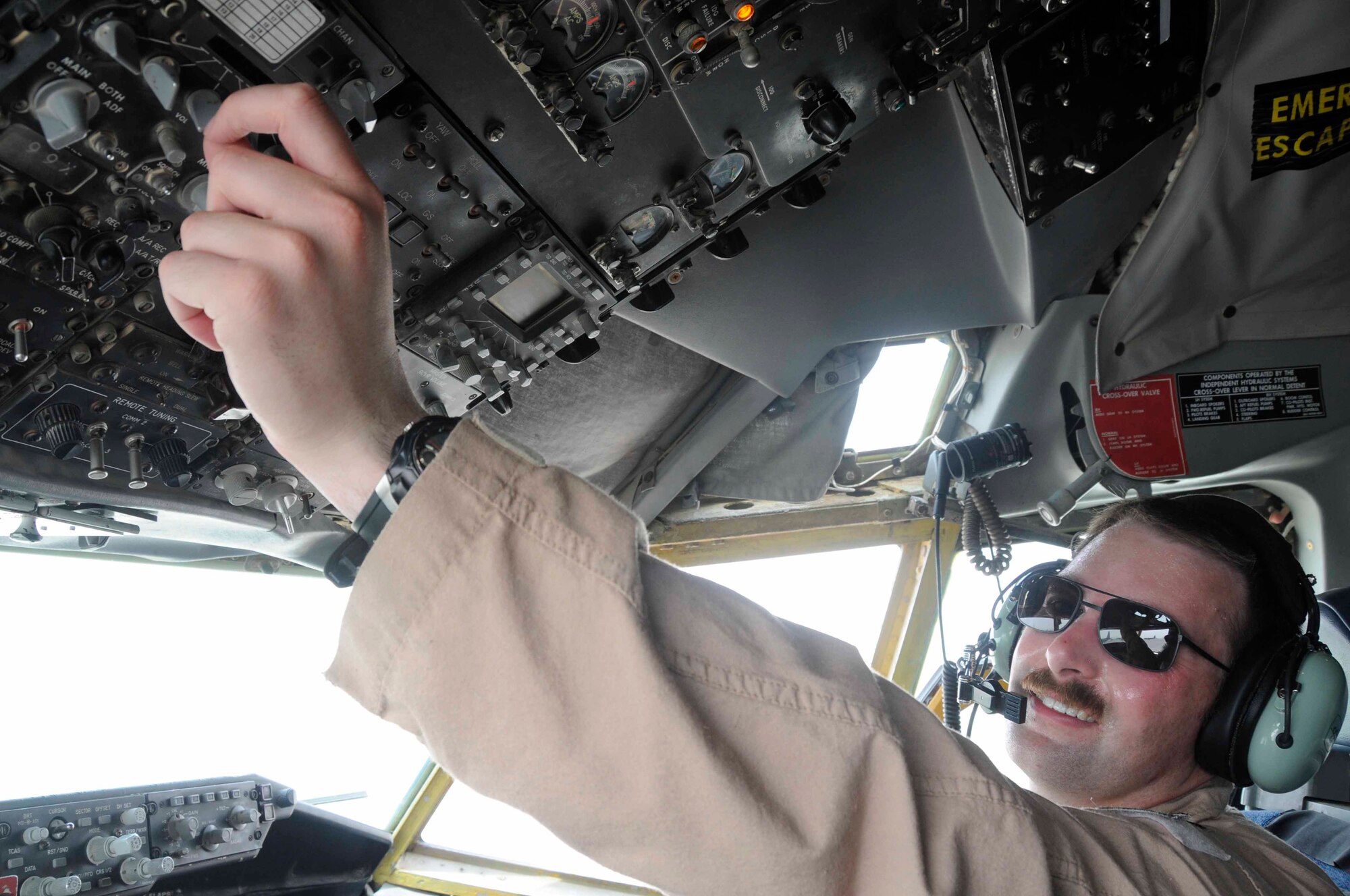 SOUTHWEST ASIA -- Capt. Brad Talley, 340th Expeditionary Air Refueling Squadron, checks switches during his pre-flight check of a KC-135 here July 21. (U.S. Air Force photo/Staff Sgt. Darnell T. Cannady)