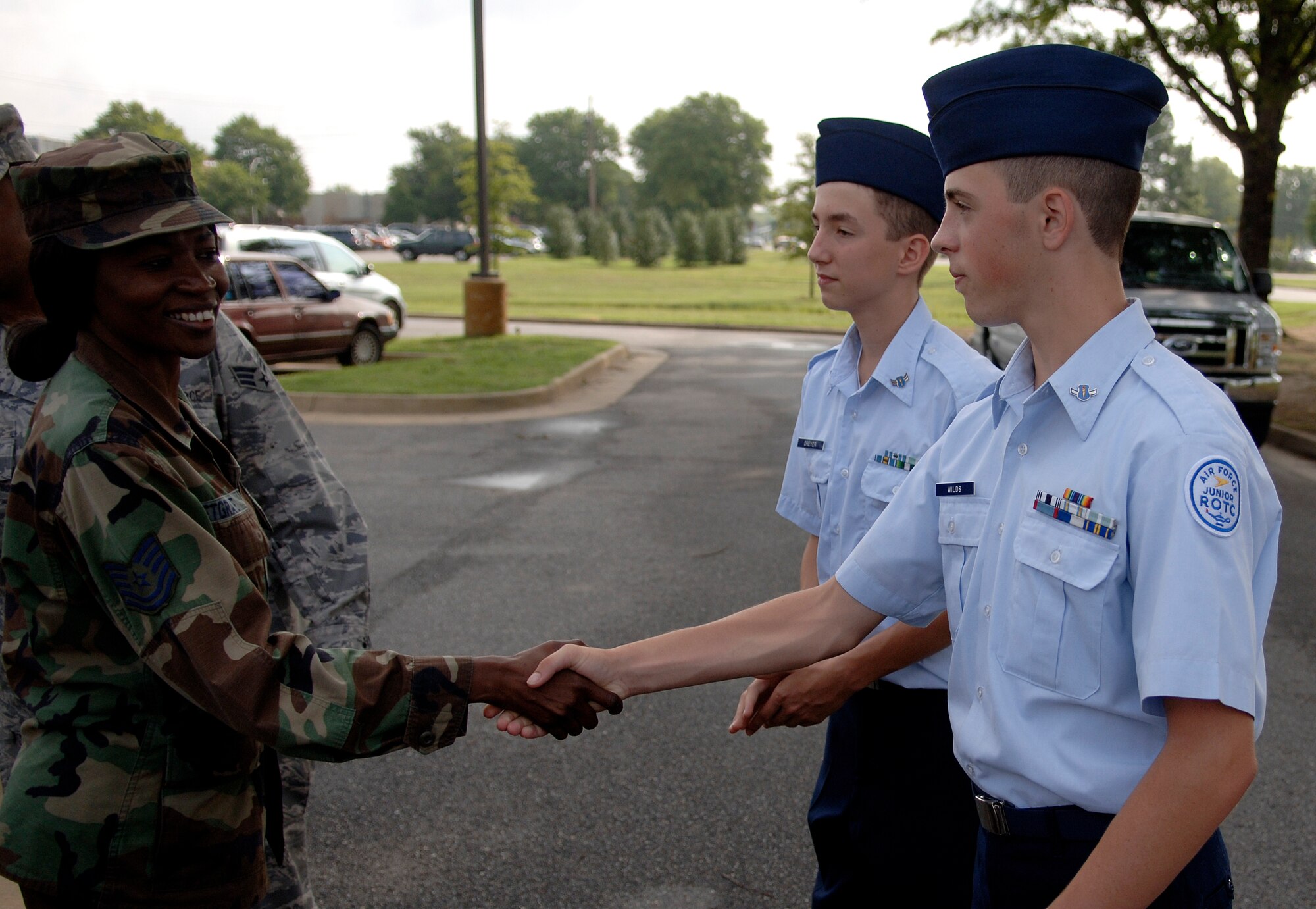 LANGLEY AIR FORCE BASE, Va. -- Tech. Sgt. Aurea Petgrave, 1st Aerospace Medical Squadron, greets Cadet Geoffrey Wilds, an Air Force Junior Reserve Officer Training Corps student from Menchville High School in Newport News, Virginia who shadowed her for the day here on July 24.  The cadets were participating in the Langley Air Force Base cadet officer leadership school, which Shadow Day is part of.  Shadow Day provides the cadets with an opportunity to meet active-duty Air Force members and gain insight into their career fields.  (U.S. Air Force photo/Tech. Sgt. Levi Collins)  