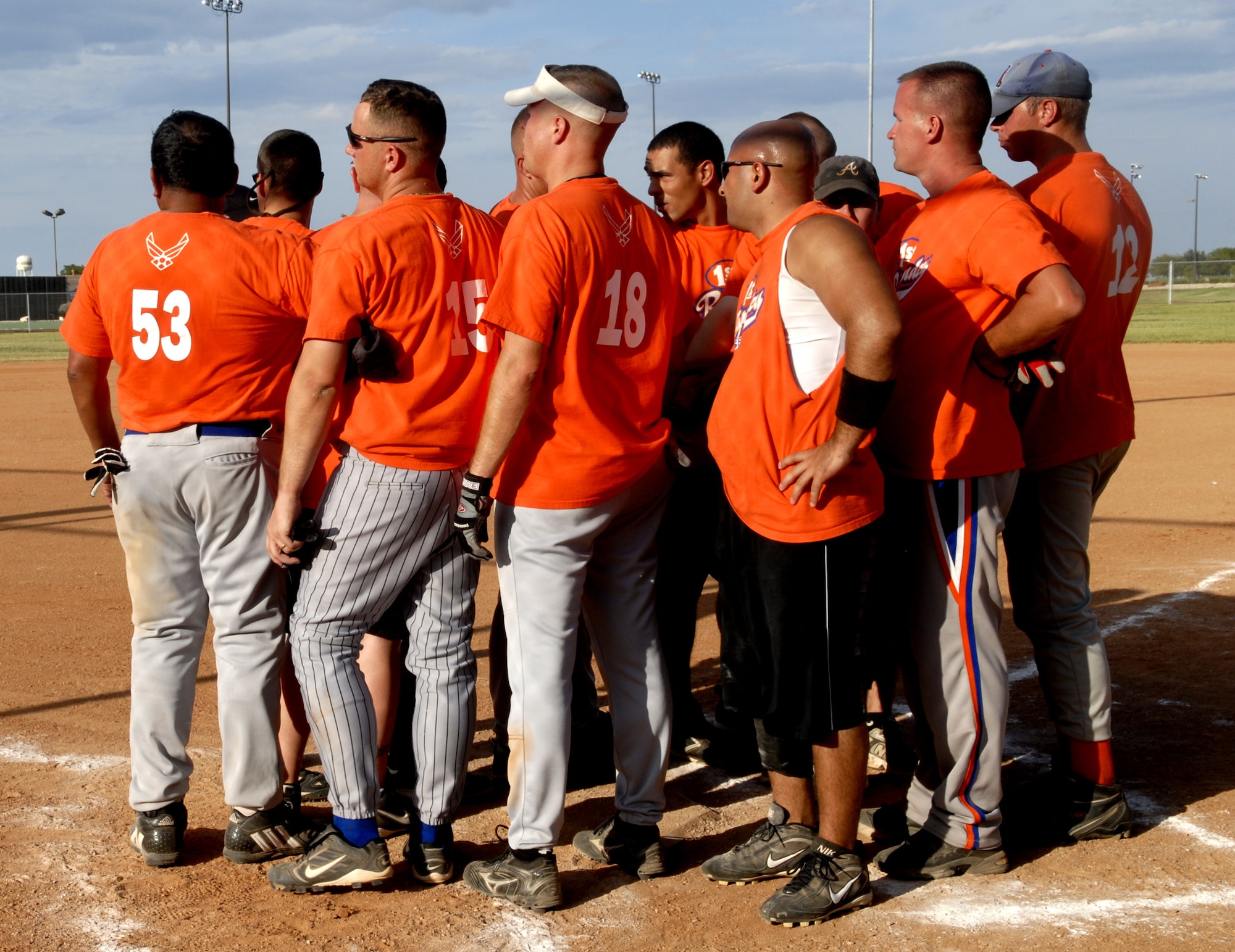 The First Responders come together for a team huddle after their loss to the Junkyard Dogs. (U.S. Air Force photo by Senior Airman Kamaile Chan)