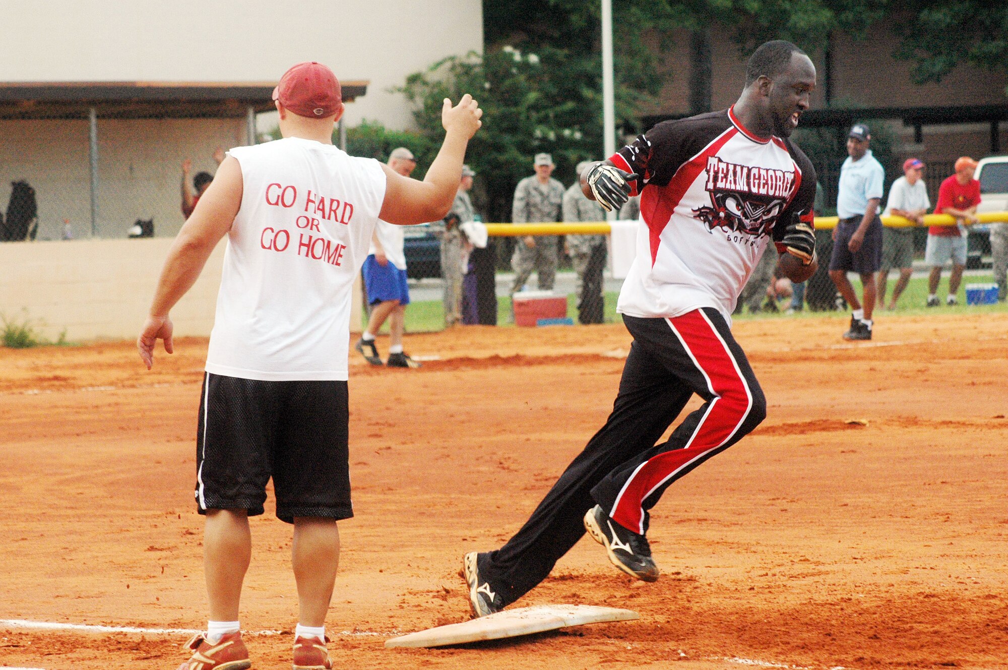 116th Maintenance Squadron's Gregiore Clements rounds the bases after hitting his second home run of the game. The 116th MXS used five  home runs to power its team to an 18-16 win over the 5th Combat Communications Squadron in the intramural softball championships.  U. S. Air Force photo by Sue Sapp