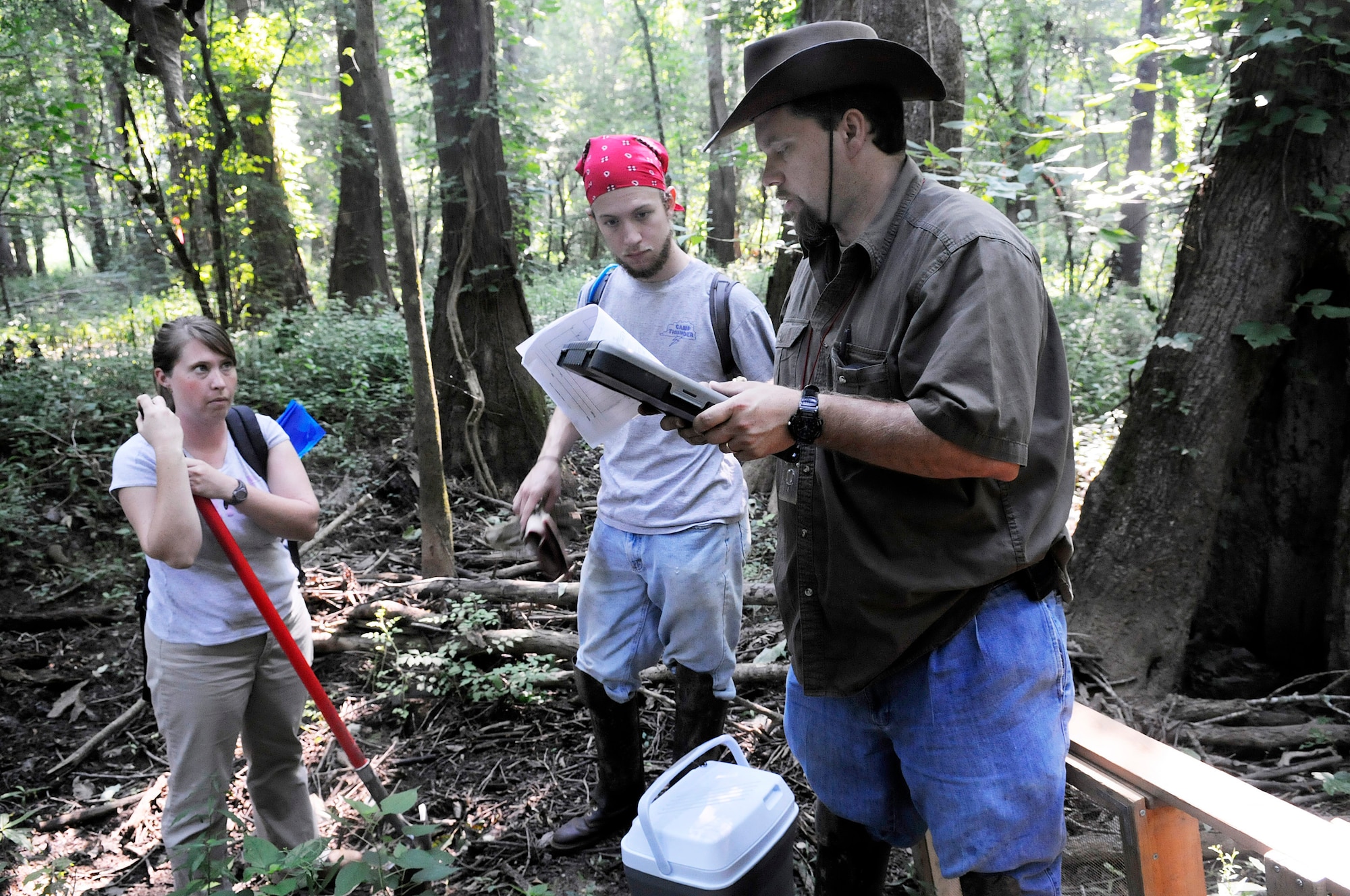 Mercer students Leah Casler, Joey Rantz and base archeologist Stephen Hammack determine the area they need to dig next. U. S. Air Force photo by Sue Sapp