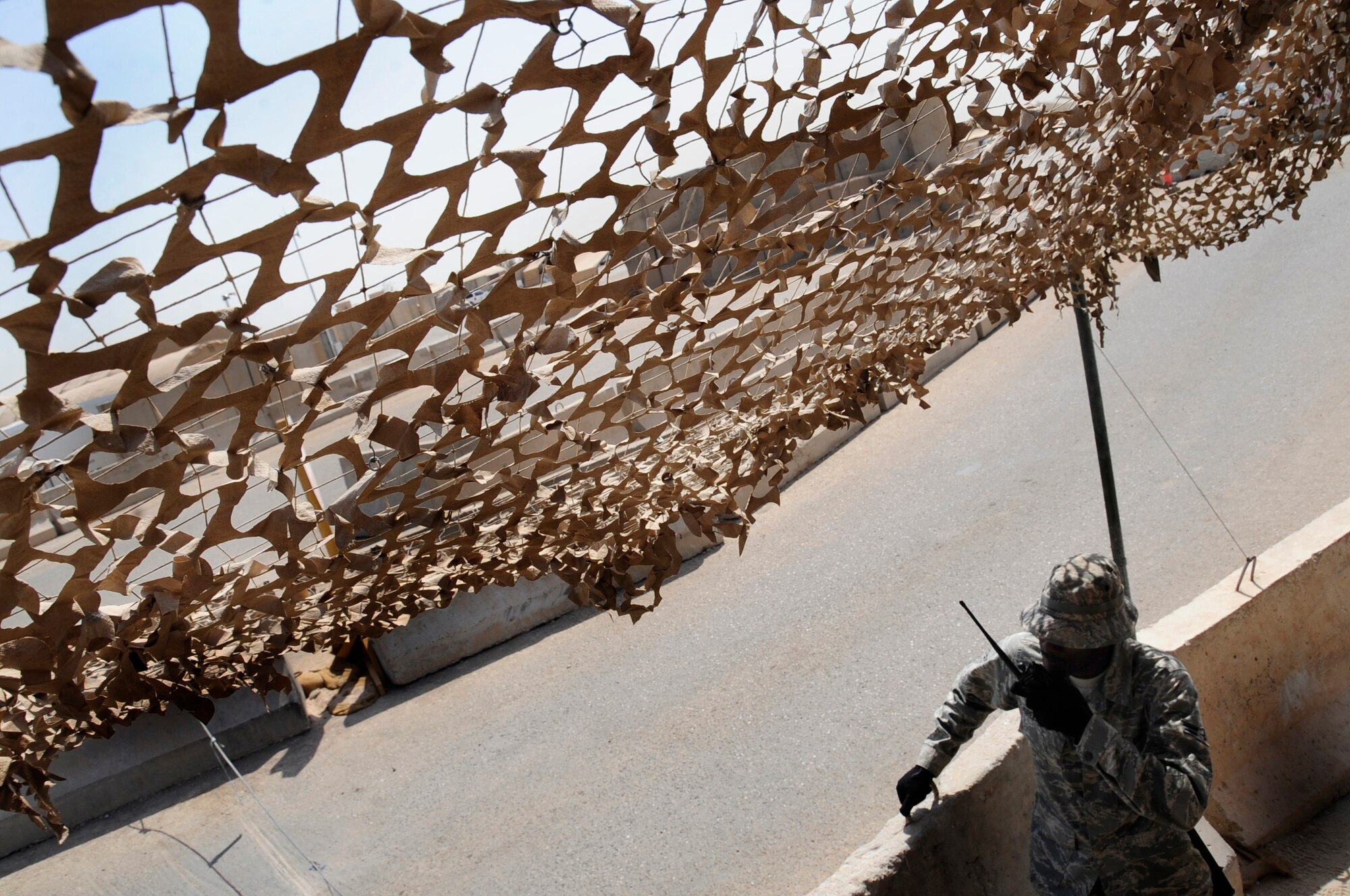 ALI BASE, Iraq ? Airman 1st Class Levante Greenwood, 407th Expeditionary Security Forces Squadron, stands post at the entry control point to Bedrock, the Air Force living area here, July 24, 2008. Airmen in the Force Protection Section are tasked with maintaining the installation's internal safety of the base. In addition to their attendant duties, FP escorts compliment security forces in securing coalition assets and personnel while enabling the group's mission. Airman Greenwood is deployed from Hurlburt Field Air Force Base, Fla. (U.S. Air Force photo/Airman 1st Class Chris Griffin)