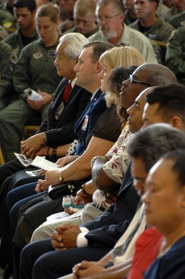 Col. George Martin's family members and Brig. Gen. Douglas Owens, 36th Wing commander, mourn the loss of Colonel Martin, 36th Medical Group deputy commander, and the five other Airmen of “Raider 21” who died Monday when the B-52 crashed 25 miles northwest of Guam. More than 1,800 guests including family members, Airmen, Sailors, Soldiers, Coast Guard members, and friends of the aircrew honored the aircrew at the ceremony here July 25. (U.S. Air Force photo by Airman 1st Class Courtney Witt) 