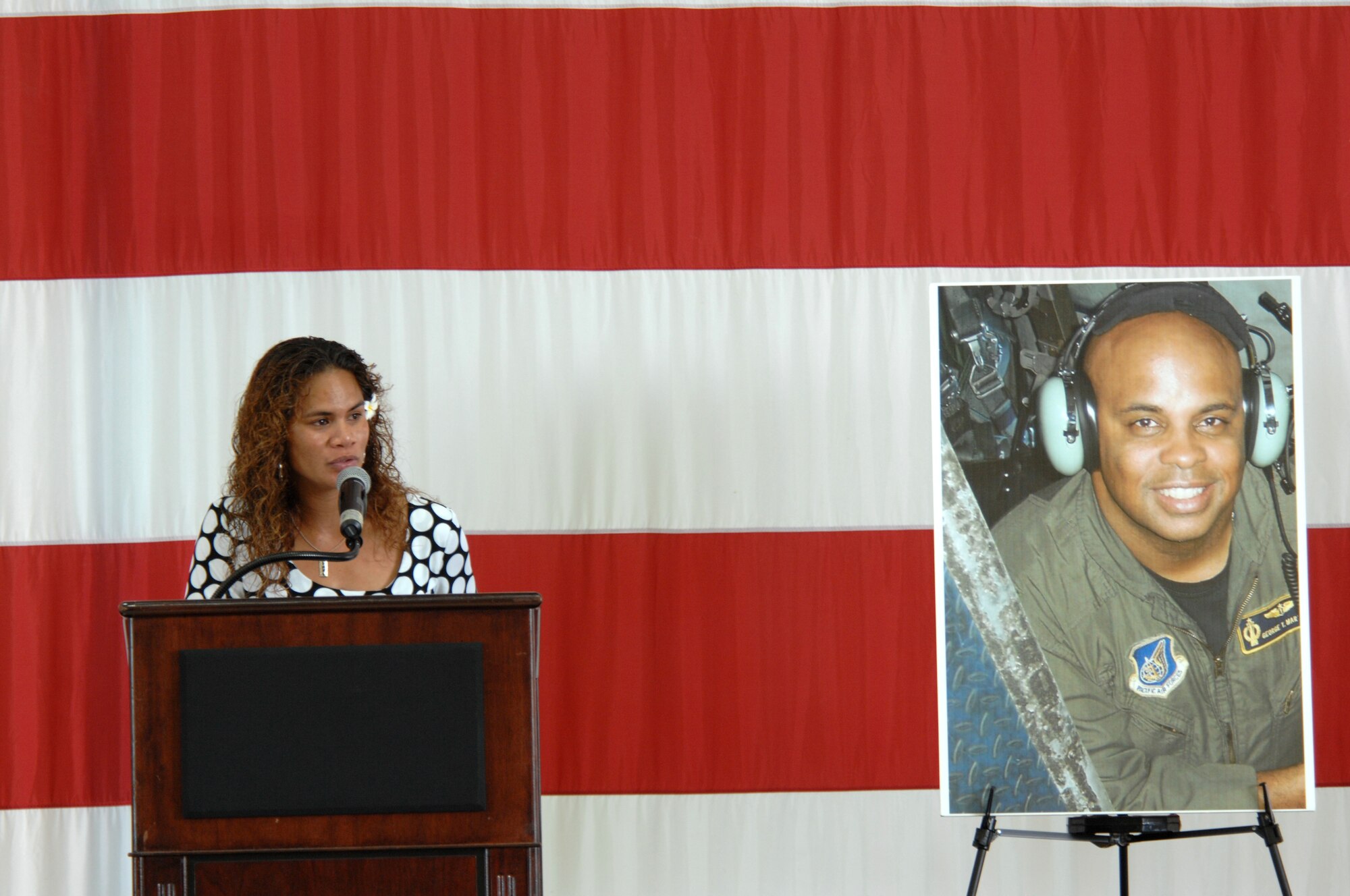 ANDERSEN AIR FORCE BASE, Guam - Ursula Martin, wife of Col. George Martin, thanks the myriad of agencies Friday in for their search for the Airmen who lost their lives in Monday’s B-52 crash.  Colonel Martin, 36th Medical Group deputy commander, was on “Raider 21” when it crashed 25 miles off the coast of Guam.  Mrs. Martin, who stands next to a photo of her husband, also extended her gratitude to Andersen’s Airmen and families for their support and shared her condolences with the families of the other aircrew members. (U.S. Air Force photo by Airman 1st Class Corey Todd)



