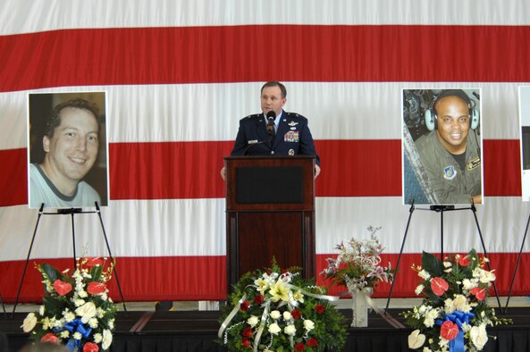 Brig. Gen. Douglas Owens, 36th Wing commander, delivers a heartfelt message to more than 1,800 guests who attended a memorial ceremony July 25 at Andersen’s Hangar One. The ceremony honored the six Airmen who died when their B-52 crashed July21, 25 miles off the coast of Guam. Their mission was to fly over Guam’s Liberation Day parade celebrating the island’s liberation from Japanese occupation in World War II. (U.S. Air Force photo by Airman 1st Class Corey Todd) 
