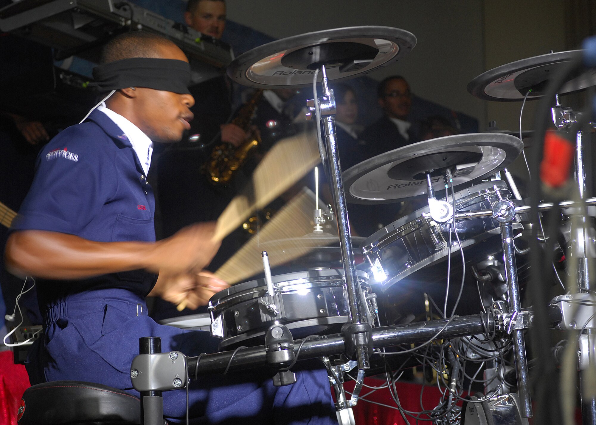 SOUTHWEST ASIA -- Airman 1st Class Christopher Gadson, a Tops in Blue performer, displays incredible techniques during a drum solo at a performance on July 24 at a base in Southwest Asia. Tops in Blue are the Air Force's premier entertainment group that performs for audiences around the globe. (U.S. Air Force photo by Tech. Sgt. Raheem Moore)   
