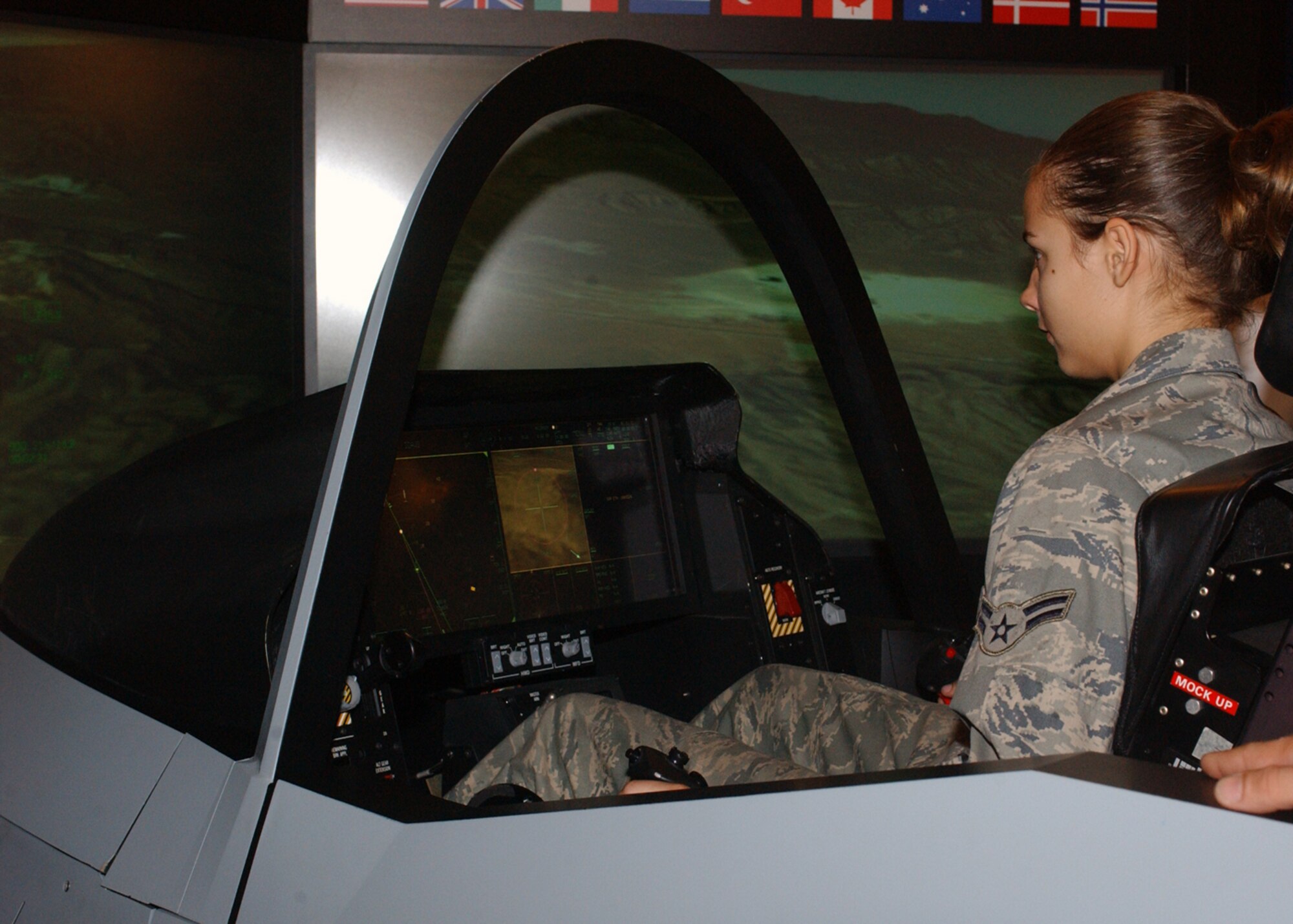 Airman 1st Class Kristen Worthington, 48th Component Maintenance Squadron lines up with the runway during a simulated F-35 Thunderbolt II flight July 24. The simulator was brought to RAF Lakenheath to show Airmen what could be in the Air Force's future. (U.S. Air Force photo by Airman 1st Class Kristopher Levasseur)