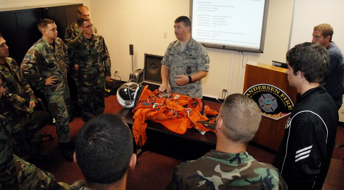 Master Sgt. Freddie McKinney from the Human Space Flight, Detachment 3, 45th Operations Group, Patrick Air Force Base, Fla., trains Andersen firemen on NASA Orbiter Response Procedures July 23. NASA trains the firefighters annually in response procedures because Andersen is an alternate space shuttle landing site. (U.S. Air Force photo by Airman 1st Class Nichelle Griffiths)   