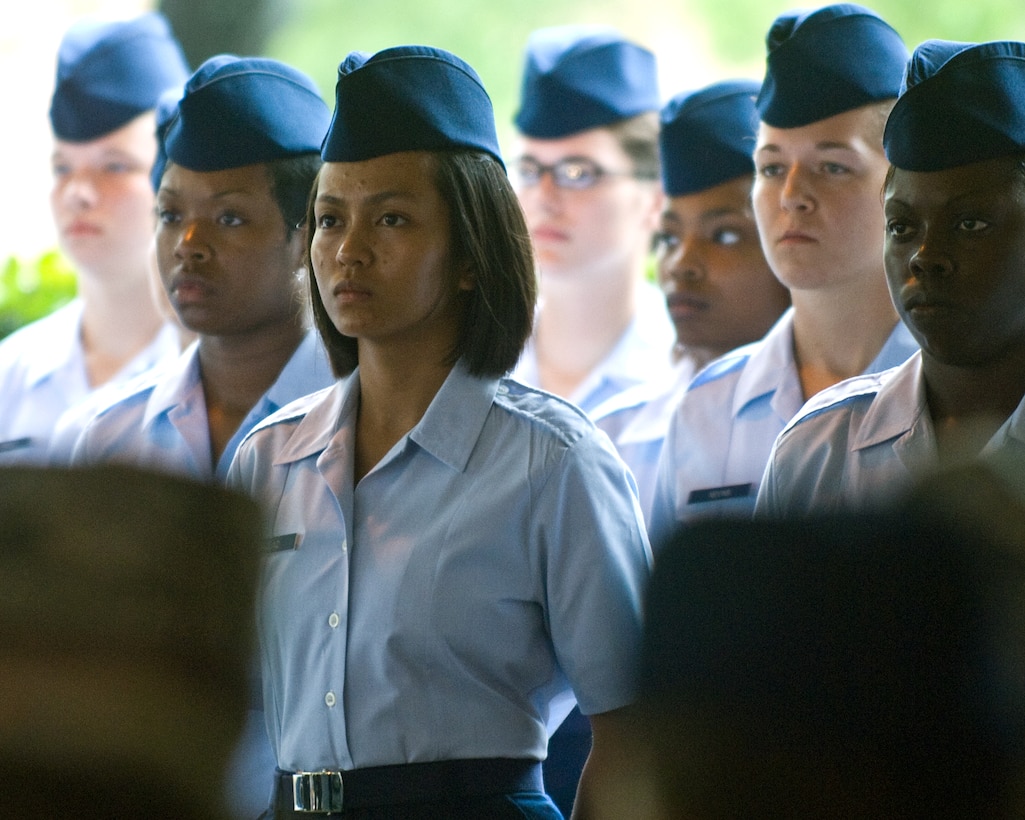 Air Force Basic Military Training graduates stand at parade rest during a coin ceremony at Lackland Air Force Base in San Antonio, Texas, July 24, 2008.  