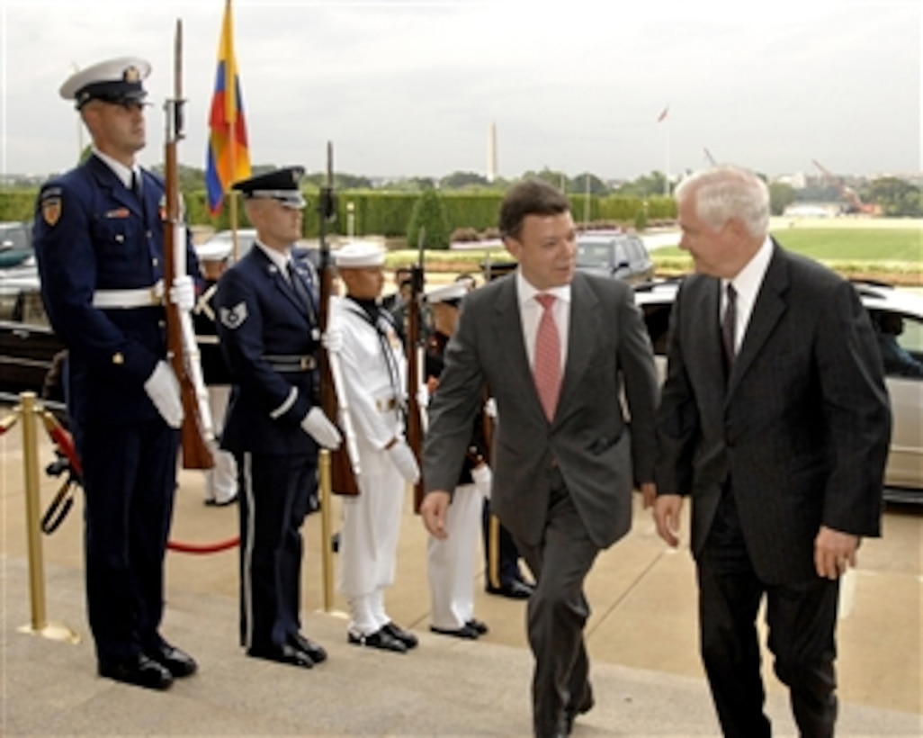 Secretary of Defense Robert M. Gates (right) escorts Colombian Minister of Defense Juan Manuel Santos through an honor cordon and into the Pentagon on July 23, 2008.  Gates and Santos will hold talks on a range of security issues of mutual interest to both nations.  