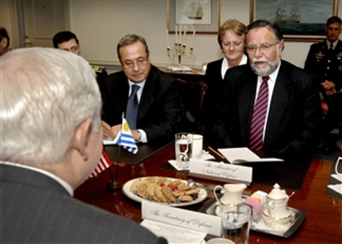 Uruguayan Minister of Defense Jose Aruro Bayardi (right) meets with Secretary of Defense Robert M. Gates (left) in the Pentagon to discuss a variety of hemispheric security issues on July 23, 2008.  Among those accompanying Bayardi is the Uruguayan Ambassador to the United States Carlos Gianelli Derois (center).  