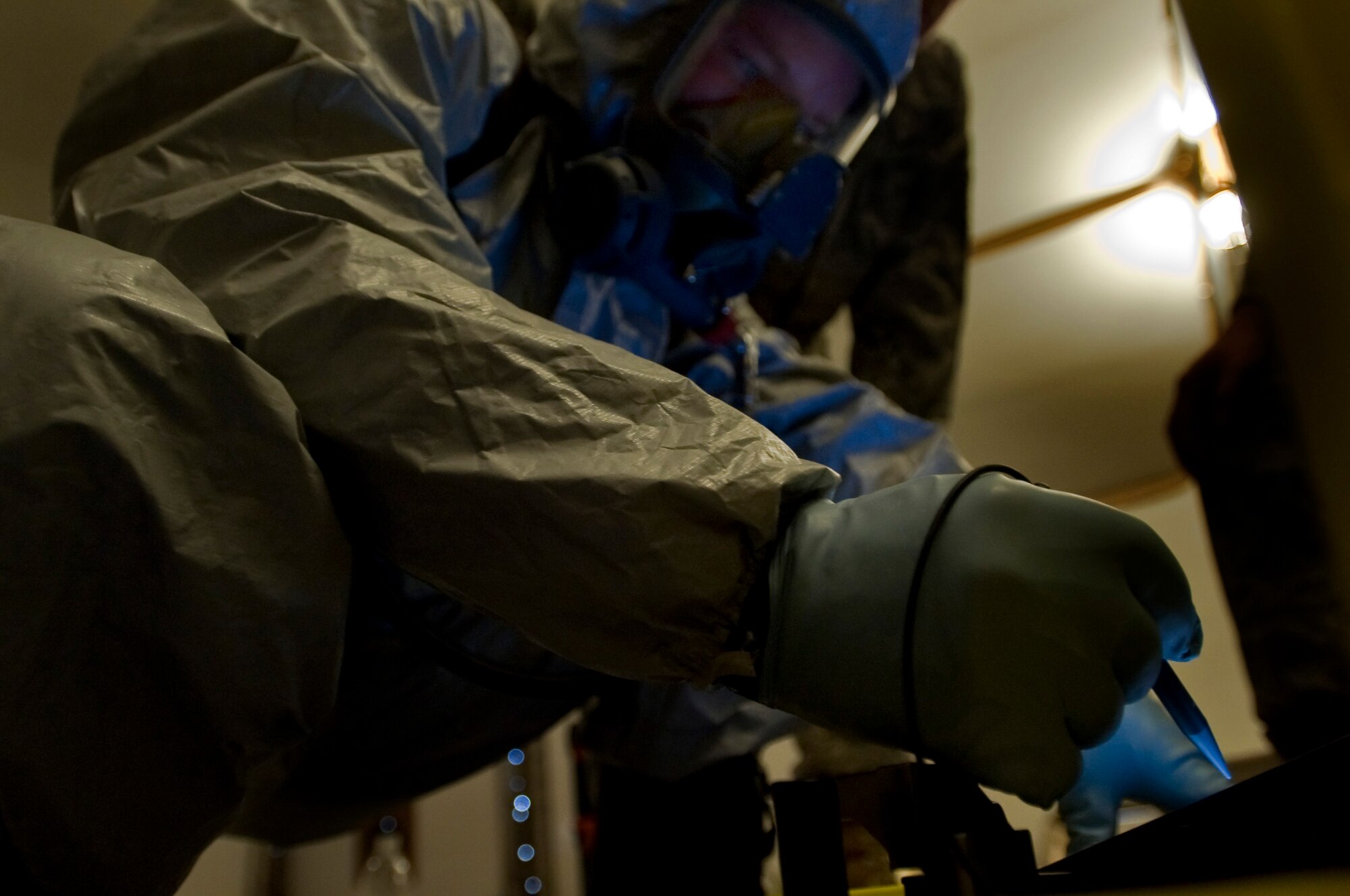 ALI BASE, Iraq -- Staff Sgt. Christian Davidson demonstrates how to prepare a hazardous material identification machine for use during training here July 26. The machine can identify thousands of chemicals. Trained Airmen across U.S. Central Command's area of responsibility can use this equipment to keep suspicious packages from becoming successful terrorist attacks. Sergeant Davidson, 407th Expeditionary Civil Engineer Squadron Emergency Management Flight member, is deployed from McGuire Air Force Base, N.J. (U.S. Air Force photo/Airman 1st Class Christopher Griffin) 