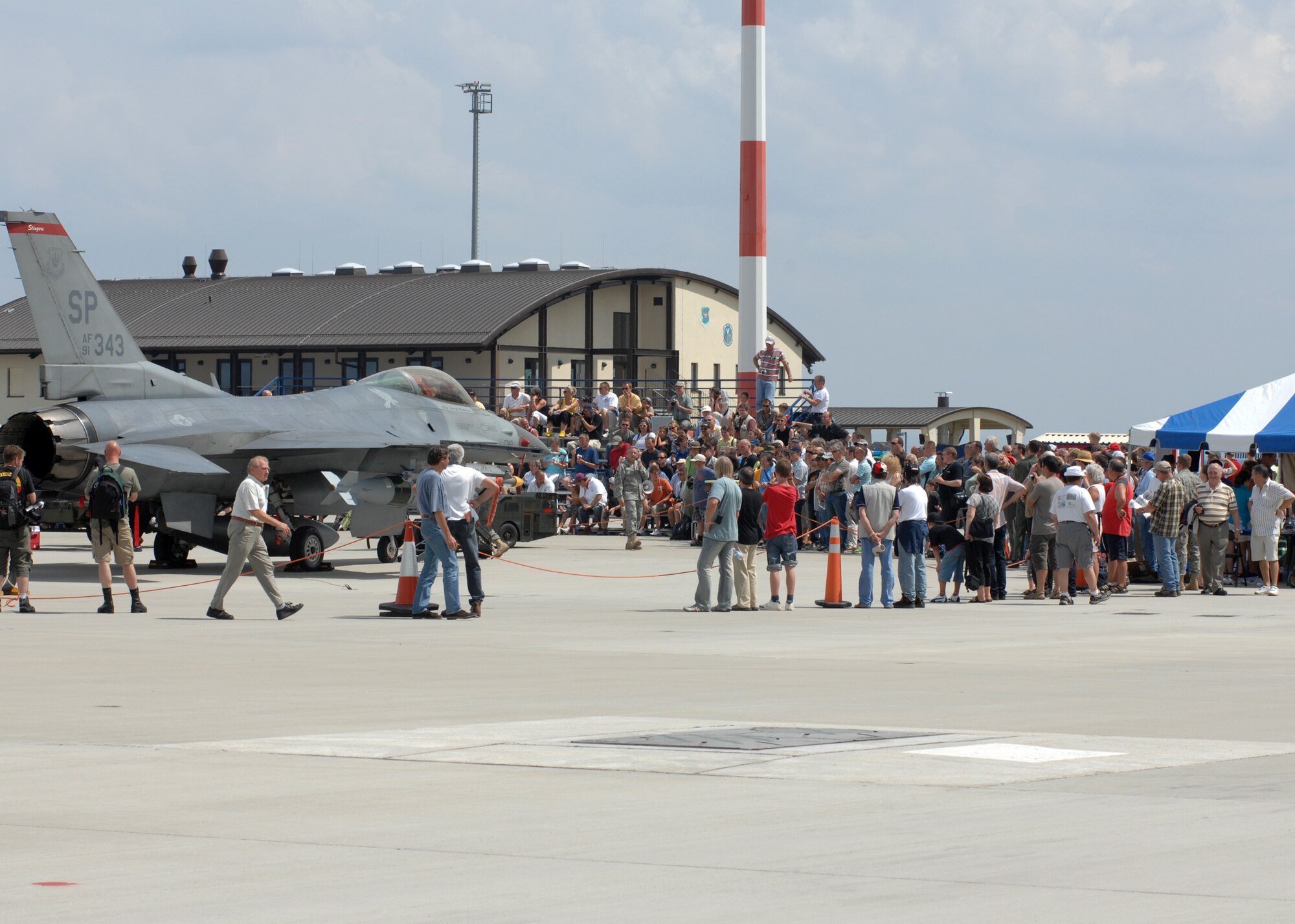SPANGDAHLEM AIR BASE, Germany – Open House visitors walk around and observe different aircraft and historical equipment, July 26, 2008. The Open House included static displays, squadron demonstrations. (U.S. Air Force photo by Airman Staci Miller)