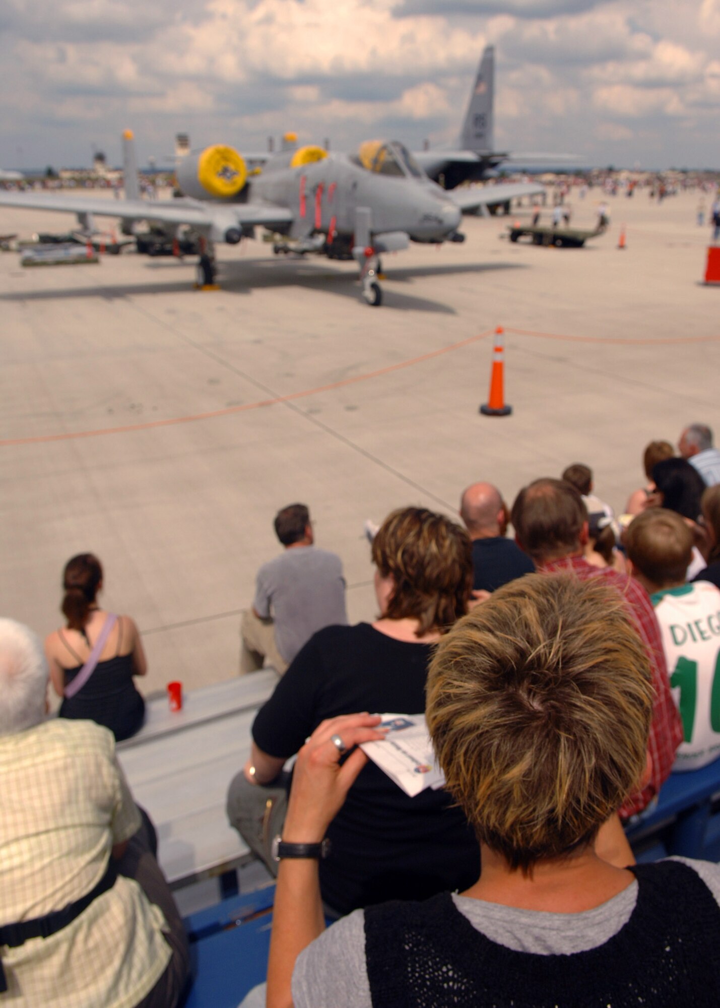 SPANGDAHLEM AIR BASE, Germany – Open House visitors sit and observe different aircraft and historical equipment, July 26, 2008. The Open House included static displays and squadron demonstrations. (U.S. Air Force photo by Airman Staci Miller)