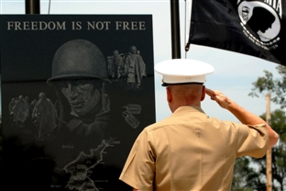 U.S. Marine Gen. James E. Cartwright, vice chairman of the Joint Chiefs of Staff, salutes during the Tri-County Korean War Memorial dedication ceremony at Loves Park, Ill., July 27, 2008. Cartwright, originally from the neighboring town of Rockford, was the keynote speaker at the event.