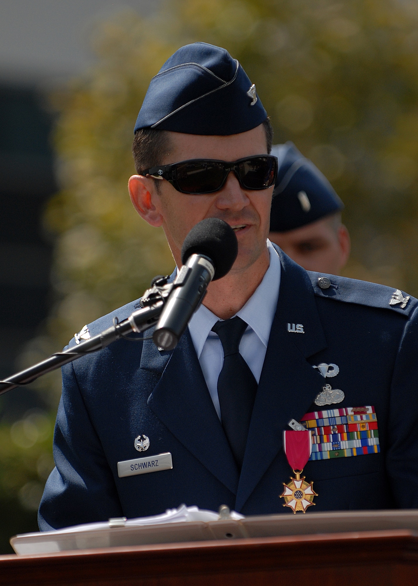Col. Joseph Schwarz, the outgoing 61st Air Base Wing commander, addresses the base personnel gathered in the Shriever Space Complex courtyard during the change of command ceremony at Los Angeles Air Force Base, July 22. (Photo by Stephen Schester)