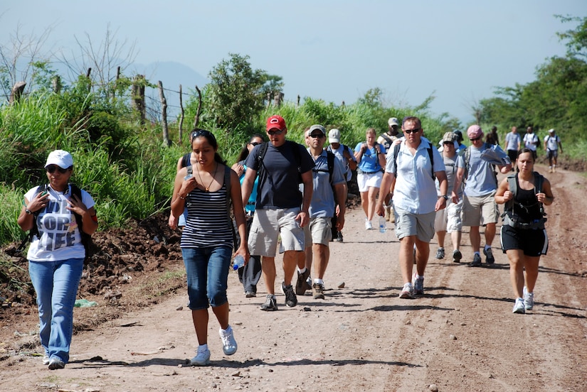 Military members from Joint Task Force-Bravo hike food into Mira Valle village in Honduras. The more than 100 troops from Soto Cano Air Base walked more than five miles to bring $900 worth of food the people in the village. (U.S. Air Force photo by Tech. Sgt. John Asselin)