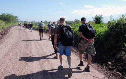 Military members and civilians from Joint Task Force-Bravo hike food into Mira Valle village in Honduras. The group of more than 100 people packed in nearly 1.600 pounds of food to the village. (U.S. Air Force photo by Tech. Sgt. John Asselin)