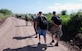 Military members and civilians from Joint Task Force-Bravo hike food into Mira Valle village in Honduras. The group of more than 100 people packed in nearly 1.600 pounds of food to the village. (U.S. Air Force photo by Tech. Sgt. John Asselin)