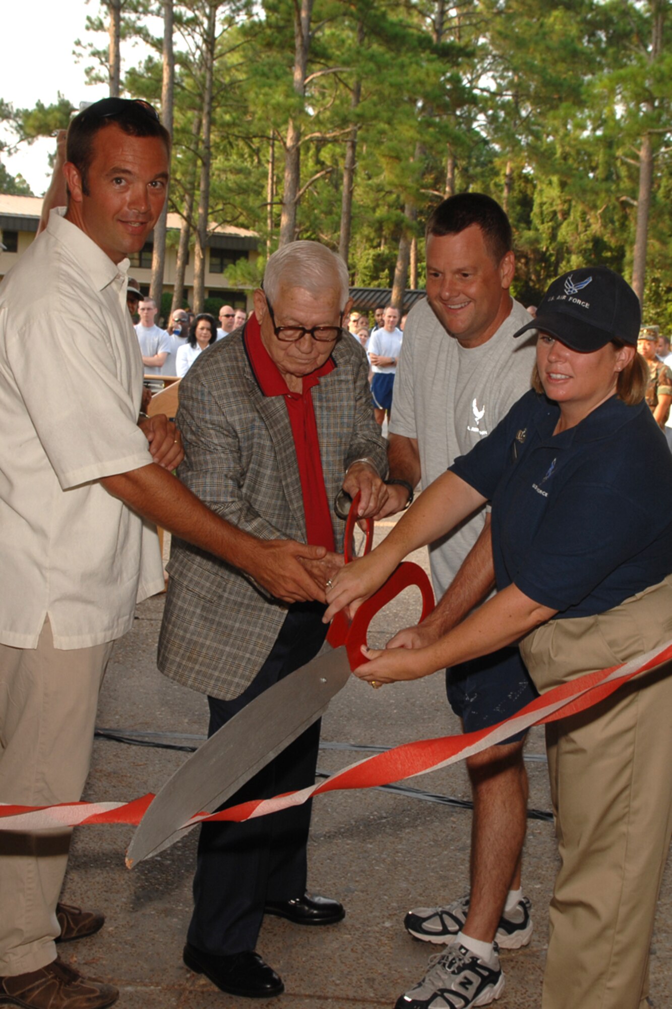(Left to right:) Levin Lord, the contractor in charge of the Aderholt Fitness Center renovation, retired Brig. Gen. Harry Aderholt, the Aderholt's namesake, Col. Brad Webb, 1st Special Operations Wing commander, and Tech. Sgt. Heather Klein, 1st Special Operations Force Support Squadron, cut the ribbon to mark the official reopening of the Aderholt July 28. The ribbon cutting kicked off a day's worth of events celebrating the Aderholt's reopening after being closed for renovations since November 2007. (U.S. Air Force photo/Airman 1st Class Kimberly Darnall)