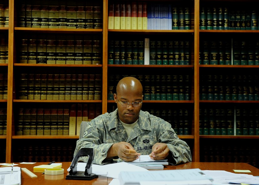 MOODY AIR FORCE BASE, Ga. -- Staff Sgt. Henry Jenkins, 23rd Wing paralegal, goes through records to make sure they are uniform and up-to-date here July 25. The Judge Advocate office prepared for the upcoming unit compliance inspection by organizing files and ensuring checklists are being followed. (U.S. Air Force photo by Airman 1st Class Brittany Barker)