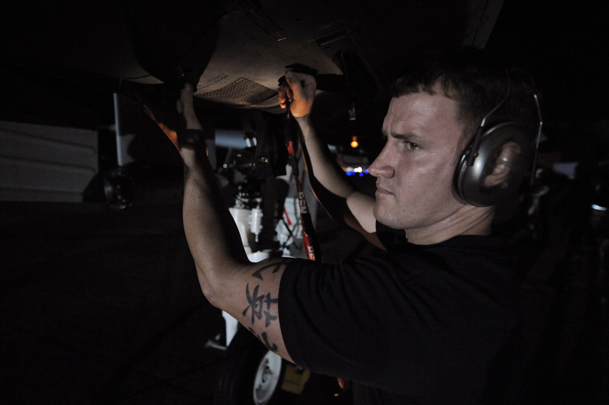 MOODY AIR FORCE BASE, Ga. -- Senior Airman Chase McClung, 23rd Aircraft Maintenance Squadron load crew member, prepares to open an inspection panel on an A-10C Thunderbolt II during end of runway checks here July 25. End of runway safety checks are performed every time an A-10C takes off and lands. (U.S. Air Force photo by Senior Airman Gina Chiaverotti)
