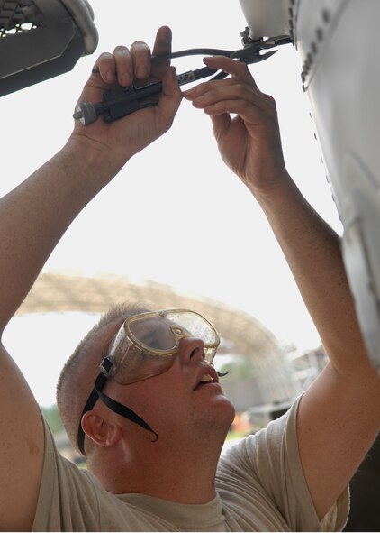 MOODY AIR FORCE BASE, Ga. – Staff Sgt. Bryan Roy, 23rd Aircraft Maintenance Squadron crew chief, clips steel saftey wire on the rudder of an A-10C Thunderbolt II here July 25. Safety wire is used to secure bolts so they will not back out in flight. (U.S. Air Force photo by Airman Joshua Green)